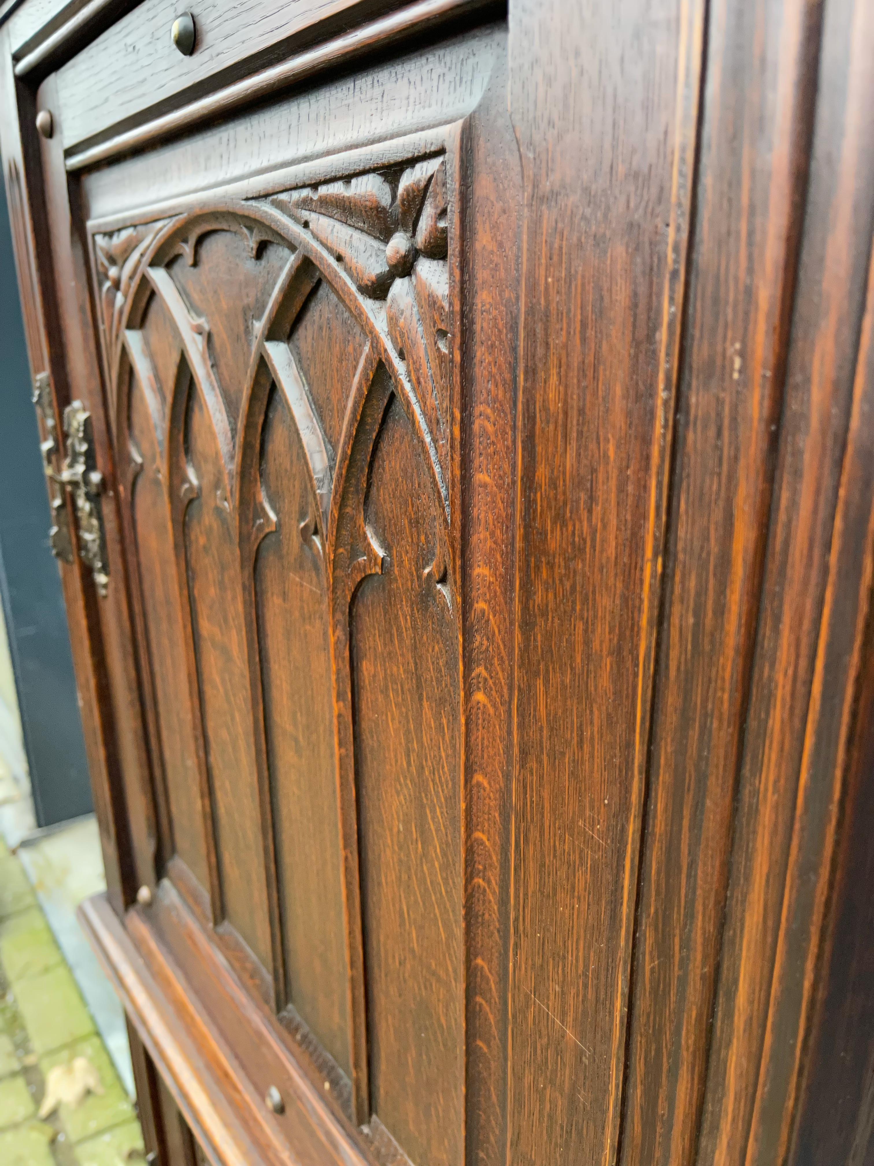 Practical Gothic Revival Carved Two Door Dry Bar Cabinet / Bookcase w. Iron Lock In Excellent Condition For Sale In Lisse, NL