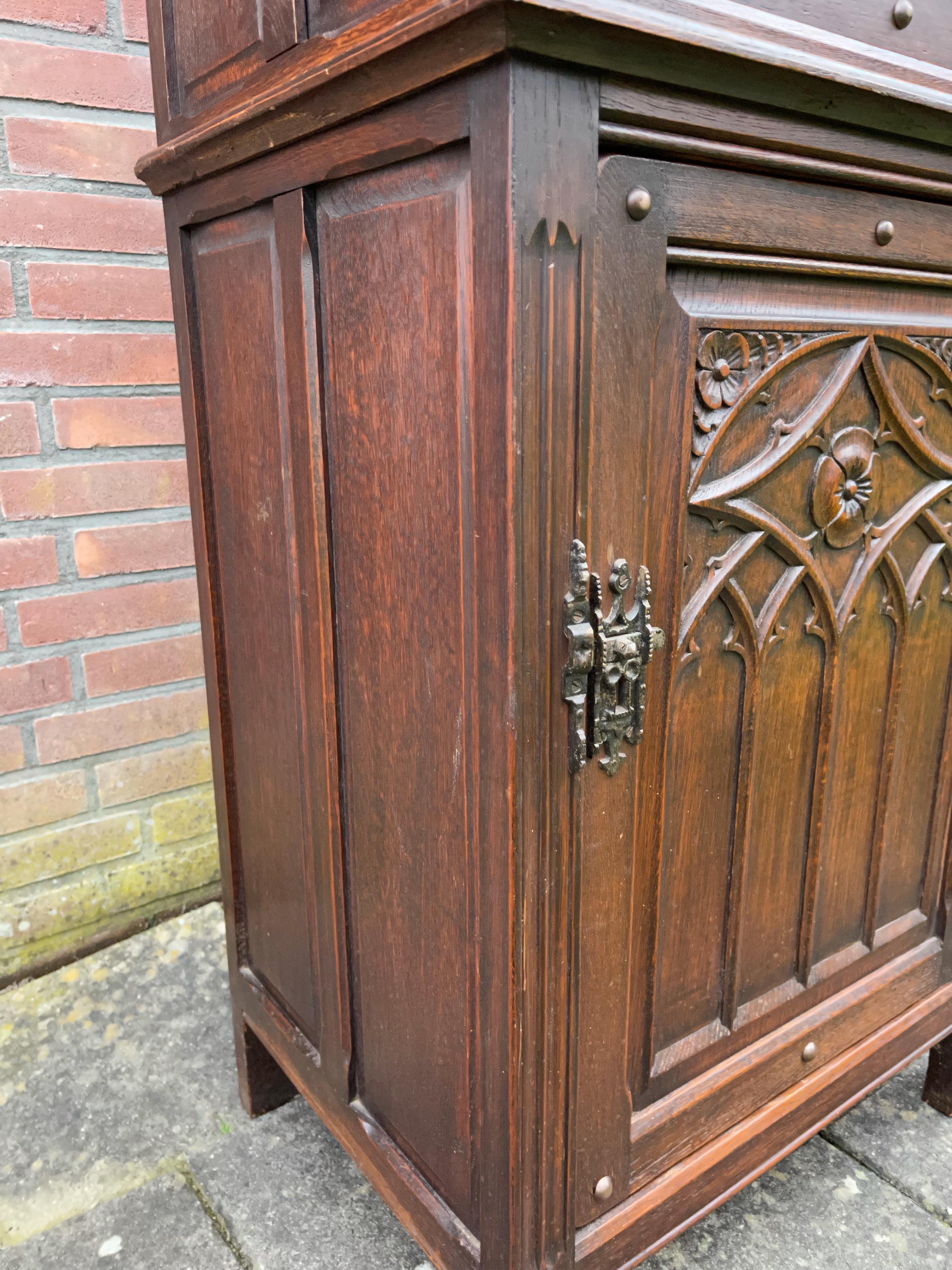 20th Century Practical Gothic Revival Carved Two Door Dry Bar Cabinet / Bookcase w. Iron Lock For Sale