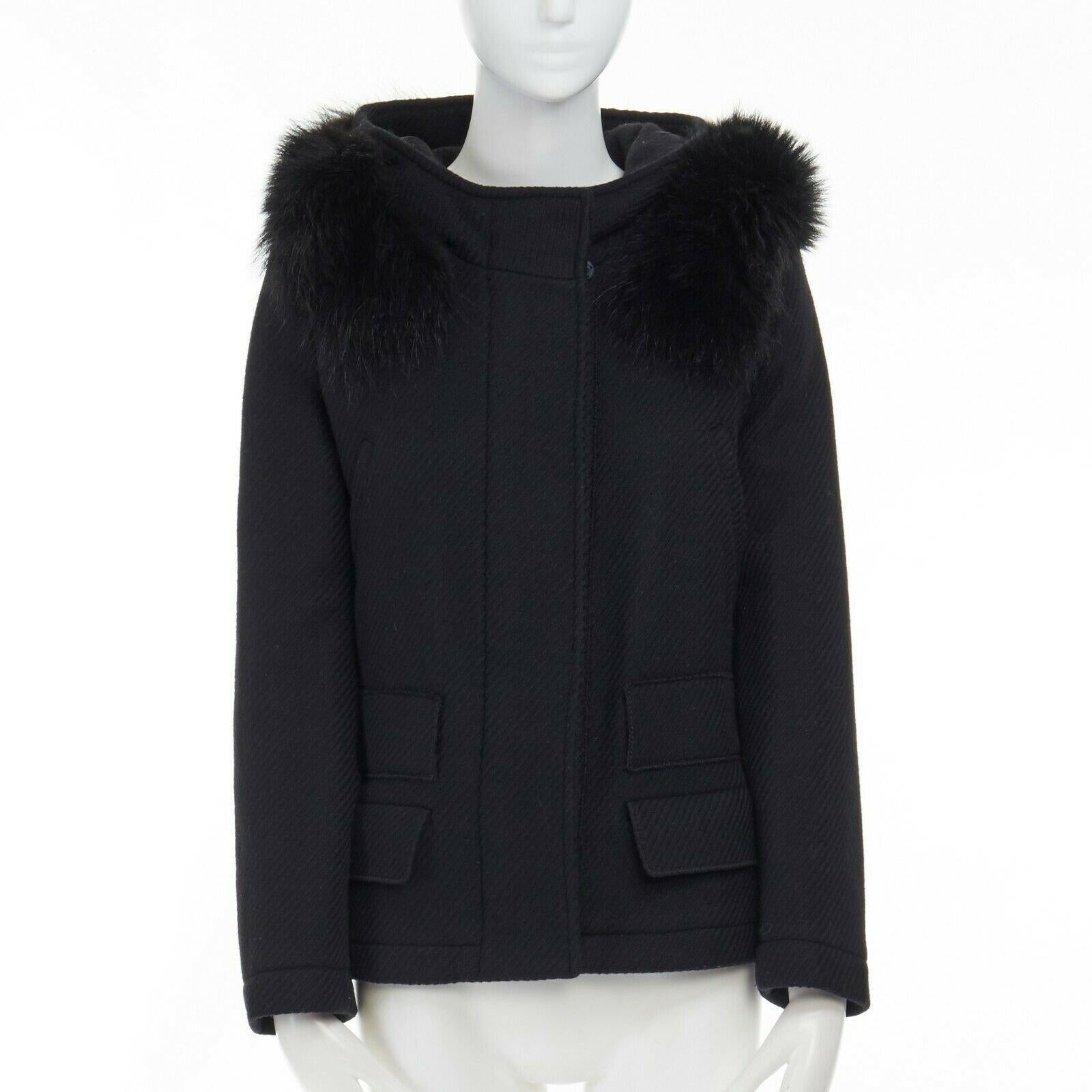 PRADA 100% virgin wool black removable fur hood zip front jacket IT42 M 
Reference: TGAS/A02946 
Brand: Prada 
Designer: Miuccia Prada 
Material: Wool 
Color: Black 
Pattern: Solid 
Closure: Zip 
Extra Detail: 100% virgin wool. Removable genuine