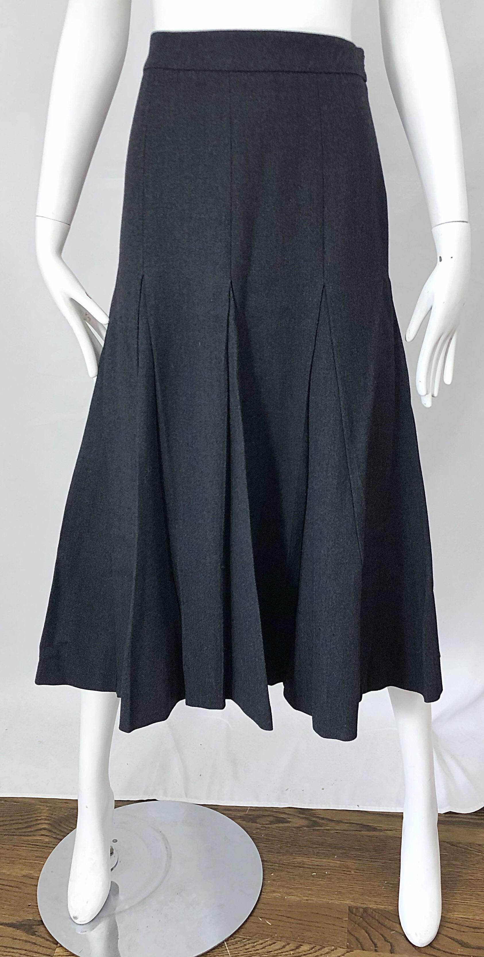 Late 90s PRADA grey wool high waisted pleated trumpet midi skirt! Features the perfect gray color that goes with anything. Hidden zipper up the side with button closure. Can easily be dressed up or down. Great with a sweater or crisp blouse. In