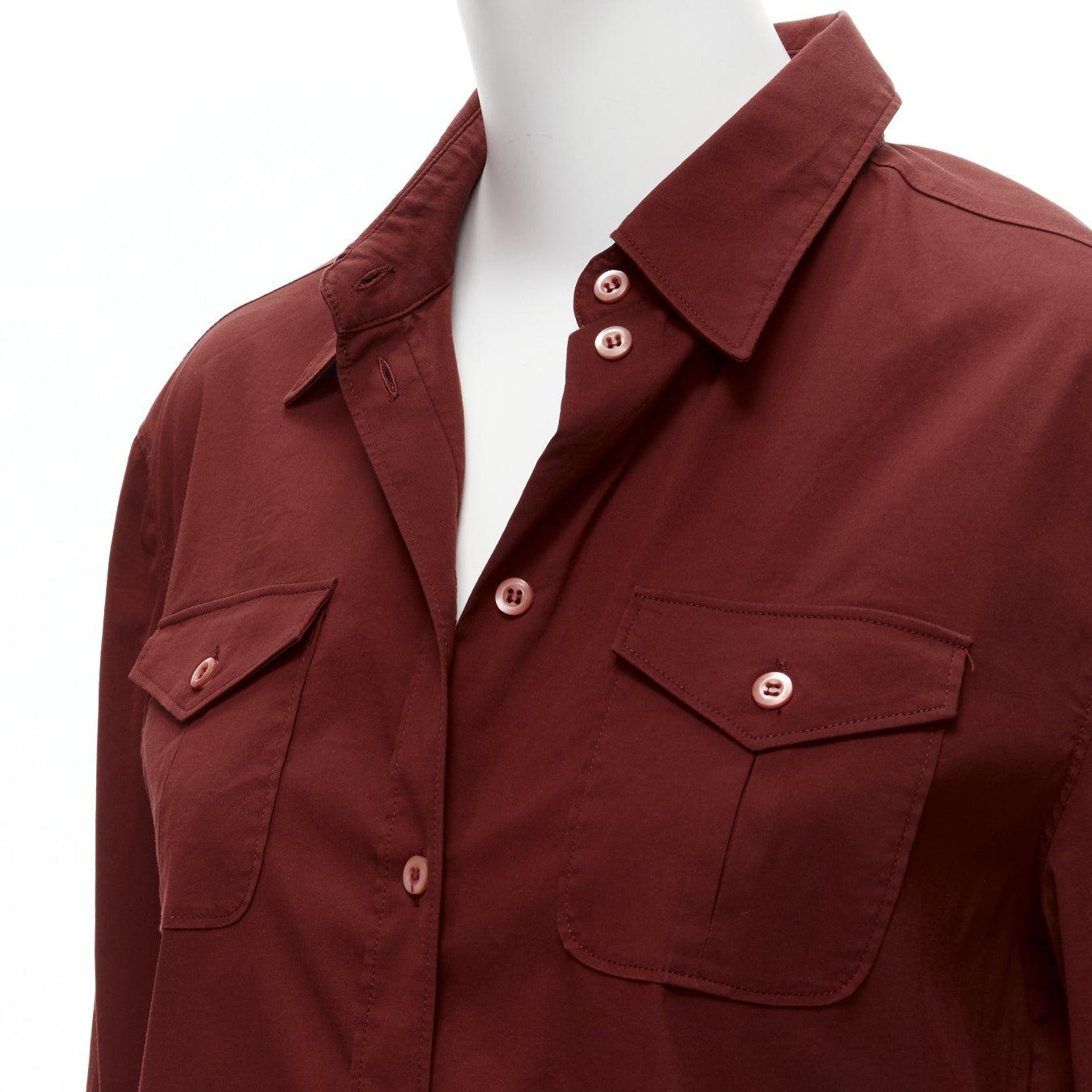 PRADA 1997 Vintage red double flap pocket button front dress shirt IT44 L
Reference: CNPG/A00029
Brand: Prada
Designer: Miuccia Prada
Collection: 1997
Material: Cotton, Nylon, Rubber
Color: Red
Pattern: Solid
Closure: Button
Made in: