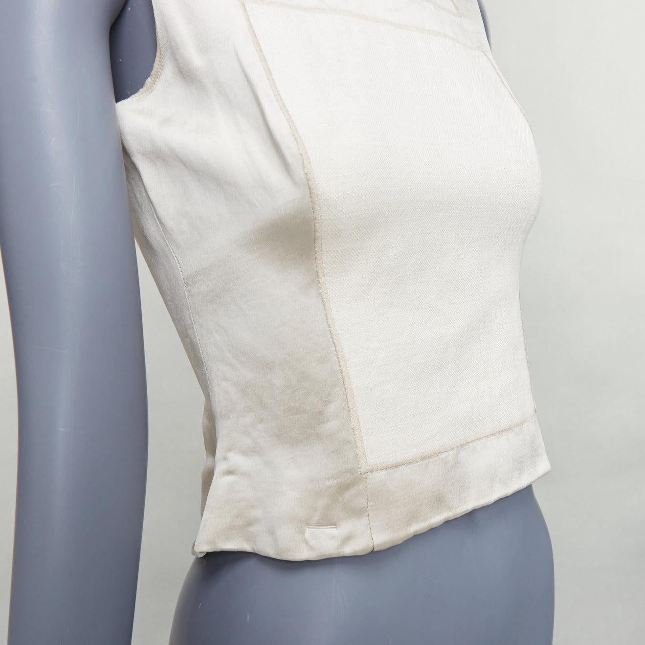 PRADA 1998 Runway cream linen silk armour patchwork crop top IT38 XS
Reference: TGAS/E00408
Brand: Prada
Designer: Miuccia Prada
Collection: SS 1998 Look 43 - Runway
Material: Linen, Silk, Cotton
Color: Cream
Pattern: Solid
Closure: Zip
Lining: