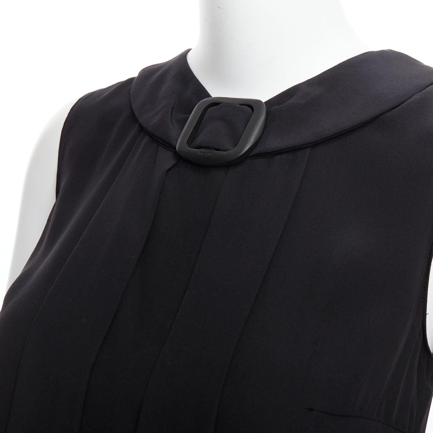 PRADA 2011 black 100% silk logo plastic buckle neck pleated top IT38 XS
Reference: LNKO/A02411
Brand: Prada
Designer: Miuccia Prada
Collection: 2011
Material: Silk
Color: Black
Pattern: Solid
Closure: Button
Extra Details: Button stand at back.
Made