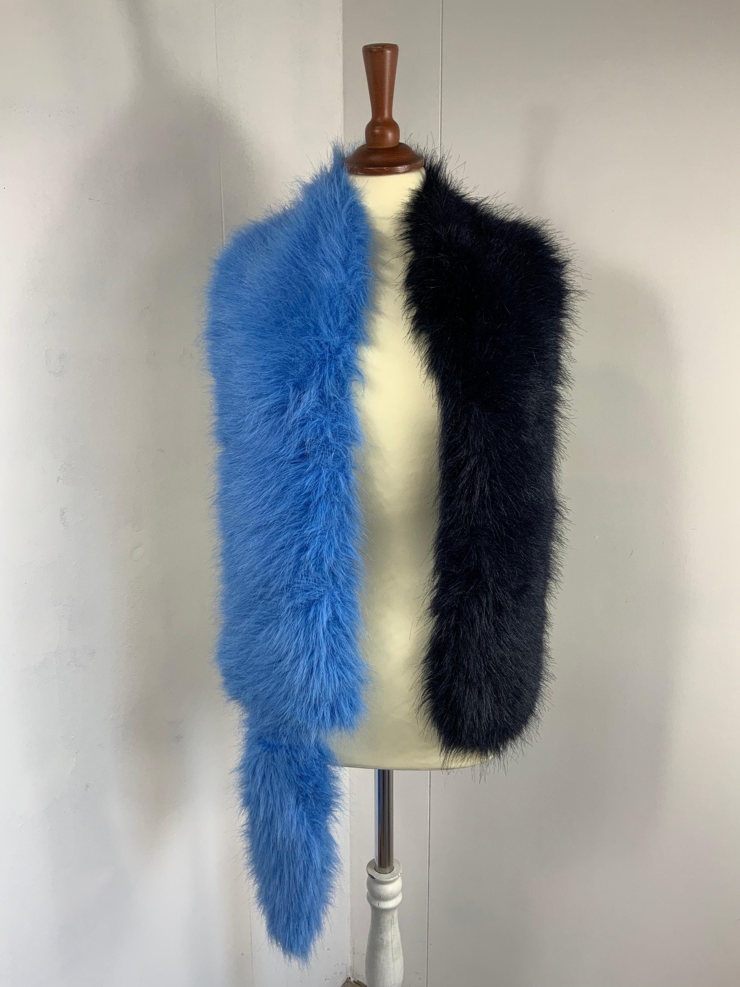 PRADA STOLE SCARF. 
Spring 2011 ready to wear collection.
Bicolor. Light blue and dark blue almost black.
The composition label has been cut.
But it’s ecological fox made in modacrylic, acrylic and Lined in polyester.
One size. It measures 170 cm X