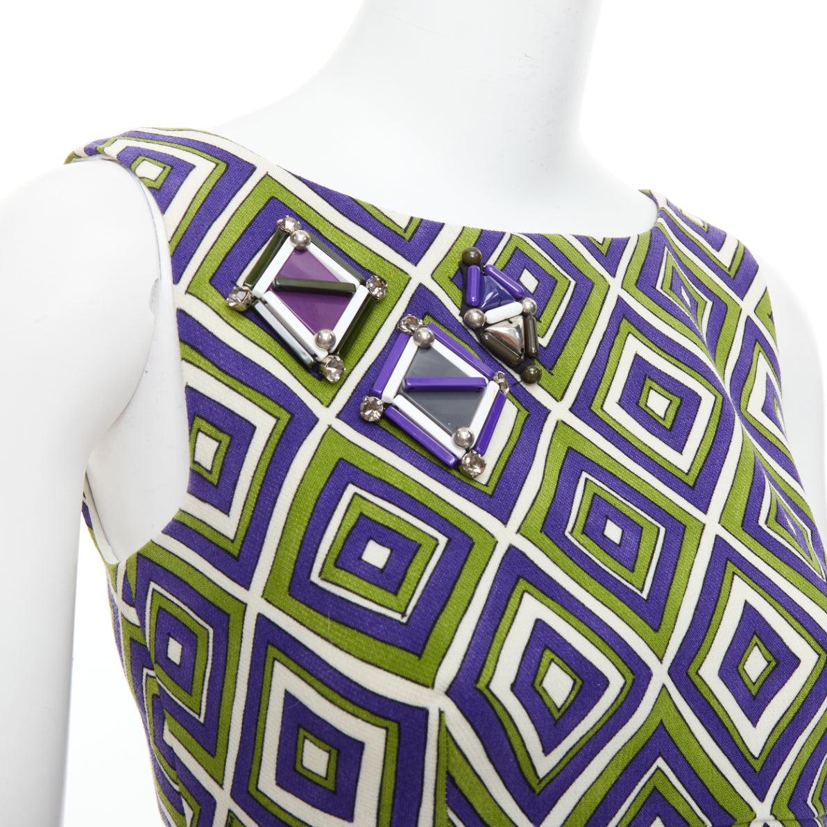 PRADA 2012 Runway vert violet résine applique robe mini mod IT38 XS
Référence : MECG/A00007
Marque : Prada
Designer : Miuccia Prada
Collection : 2012
Vu sur : Anna Wintour
MATERIAL : Laine vierge
Couleur : vert, violet
Motif : damier
Fermeture :