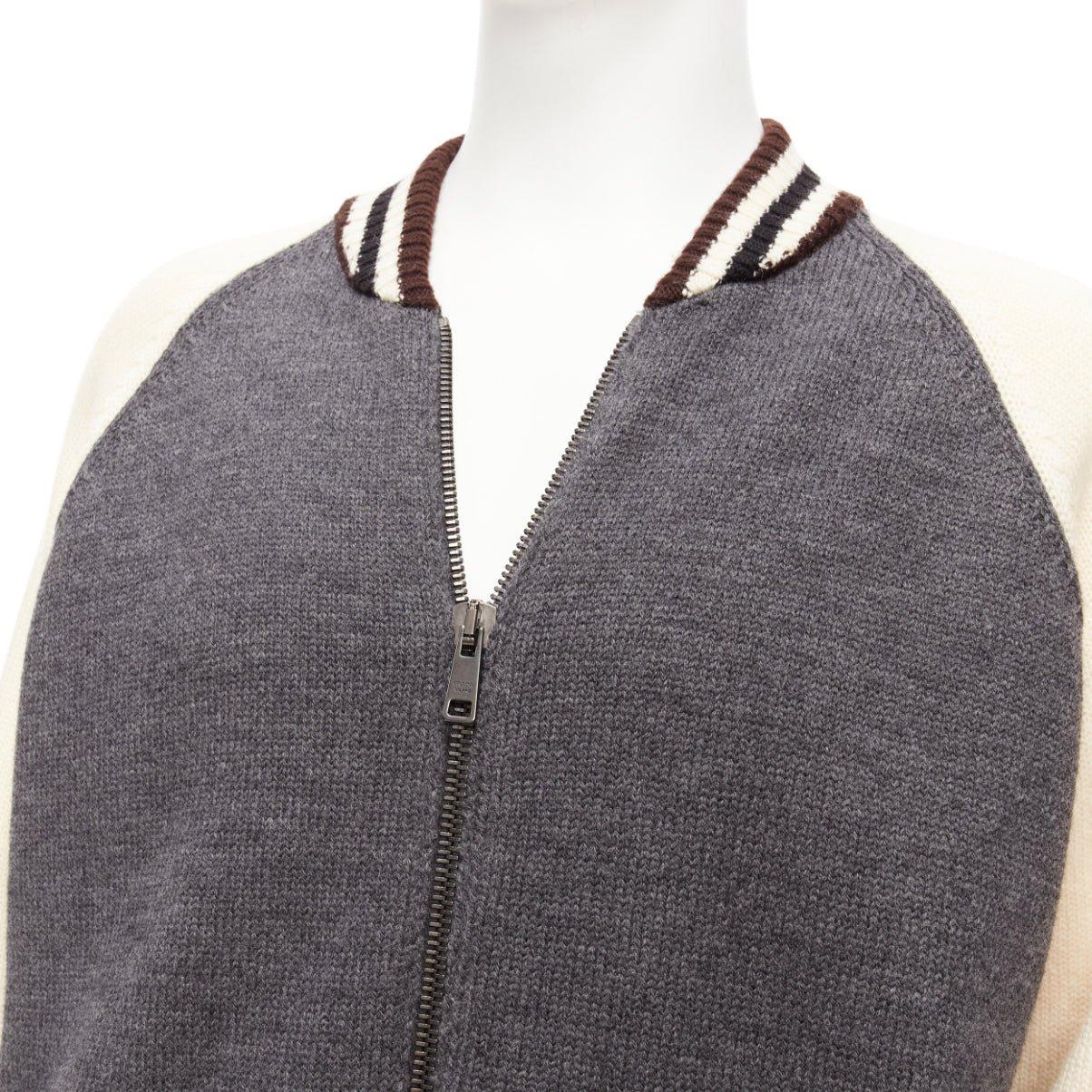 PRADA 2014 100% wool knit cream grey raglan varsity bomber jacket IT50 L
Reference: TGAS/D00889
Brand: Prada
Designer: Miuccia Prada
Collection: AW 2014
Material: Wool
Color: Grey, Cream
Pattern: Solid
Closure: Zip
Made in: