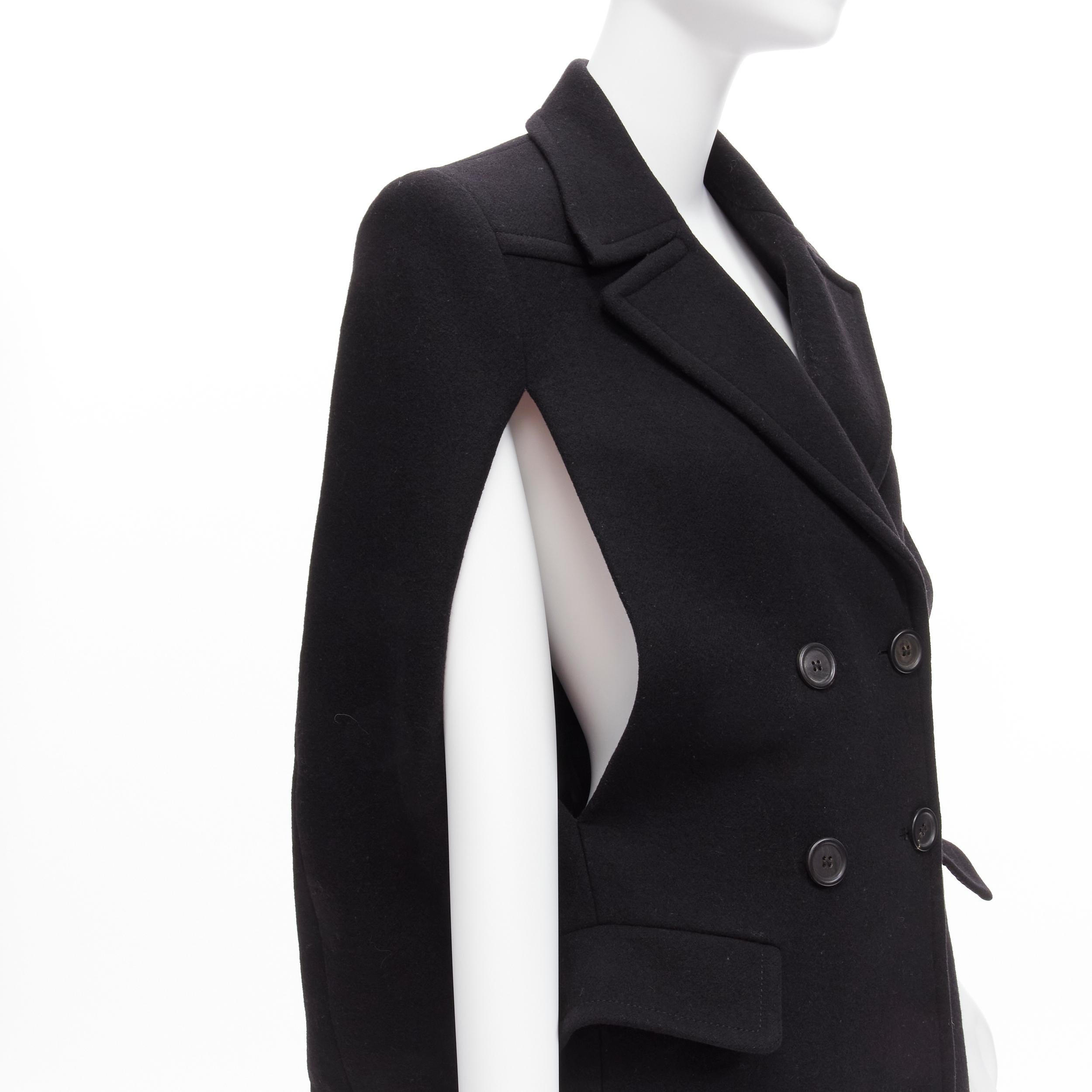 PRADA 2014 black virgin wool double breasted poncho cape coat IT38 XS
Reference: TGAS/D00143
Brand: Prada
Designer: Miuccia Prada
Collection: 2014
Material: Virgin Wool
Color: Black
Pattern: Solid
Closure: Button
Lining: Black Fabric
Made in: