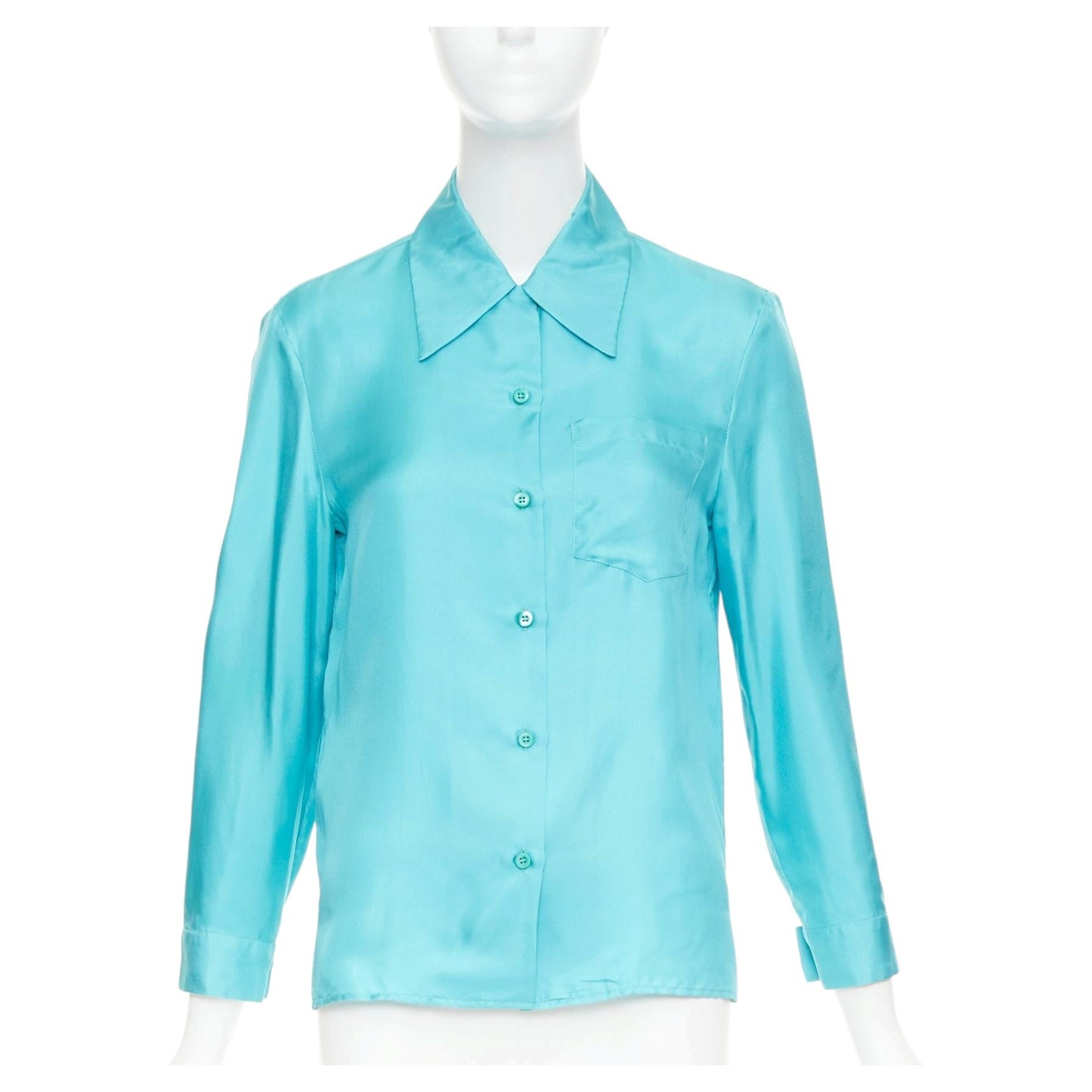 PRADA 2015 Camisa abotonada 100% seda azul turquesa de cuello ancho con bolsillos IT38 XS