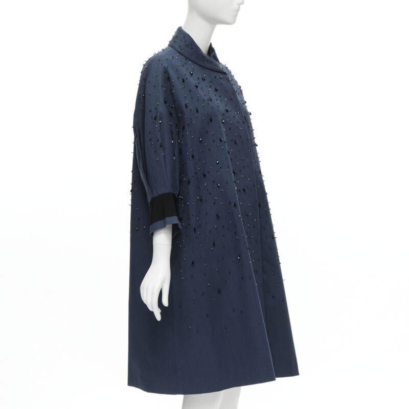PRADA 2015 blue cotton crystal rhinestone embellished cocoon coat IT38 XS
Reference: CELG/A00056
Brand: Prada
Designer: Miuccia Prada
Collection: 2015 - Runway
Material: Cotton
Color: Blue
Pattern: Solid
Closure: Snap Buttons
Extra Details: Navy