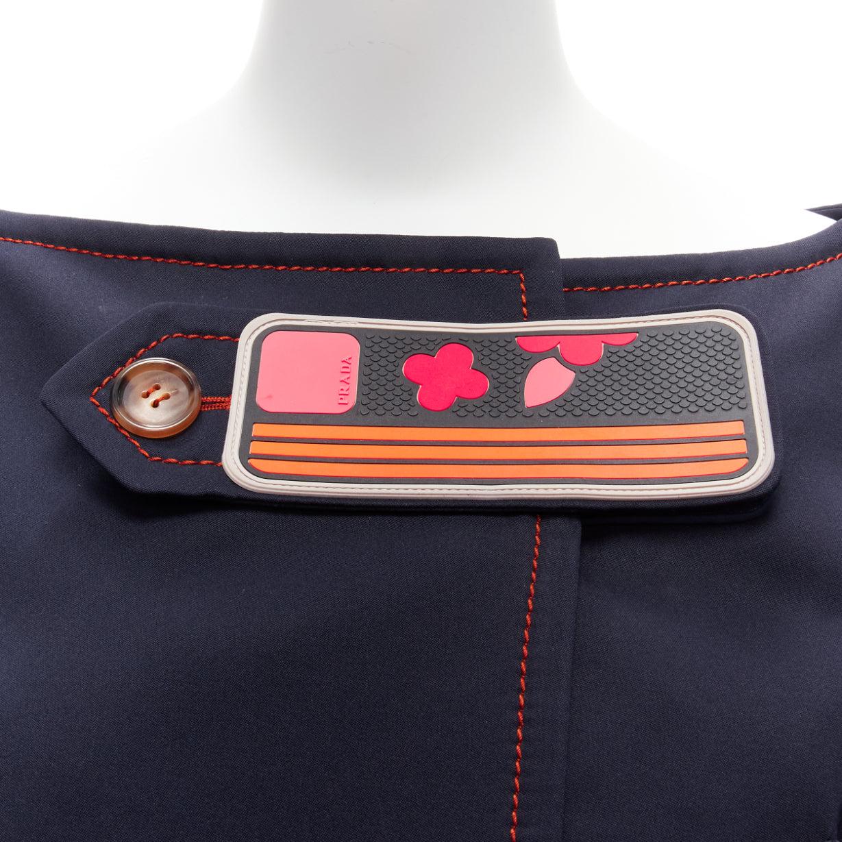 PRADA 2017 orange pink logo rubber patch navy cream piping bateau cropped jacket IT40 S
Reference: TGAS/D00618
Brand: Prada
Designer: Miuccia Prada
Collection: SS 2017
Material: Polyester
Color: Navy, Multicolour
Pattern: Solid
Closure: Magic