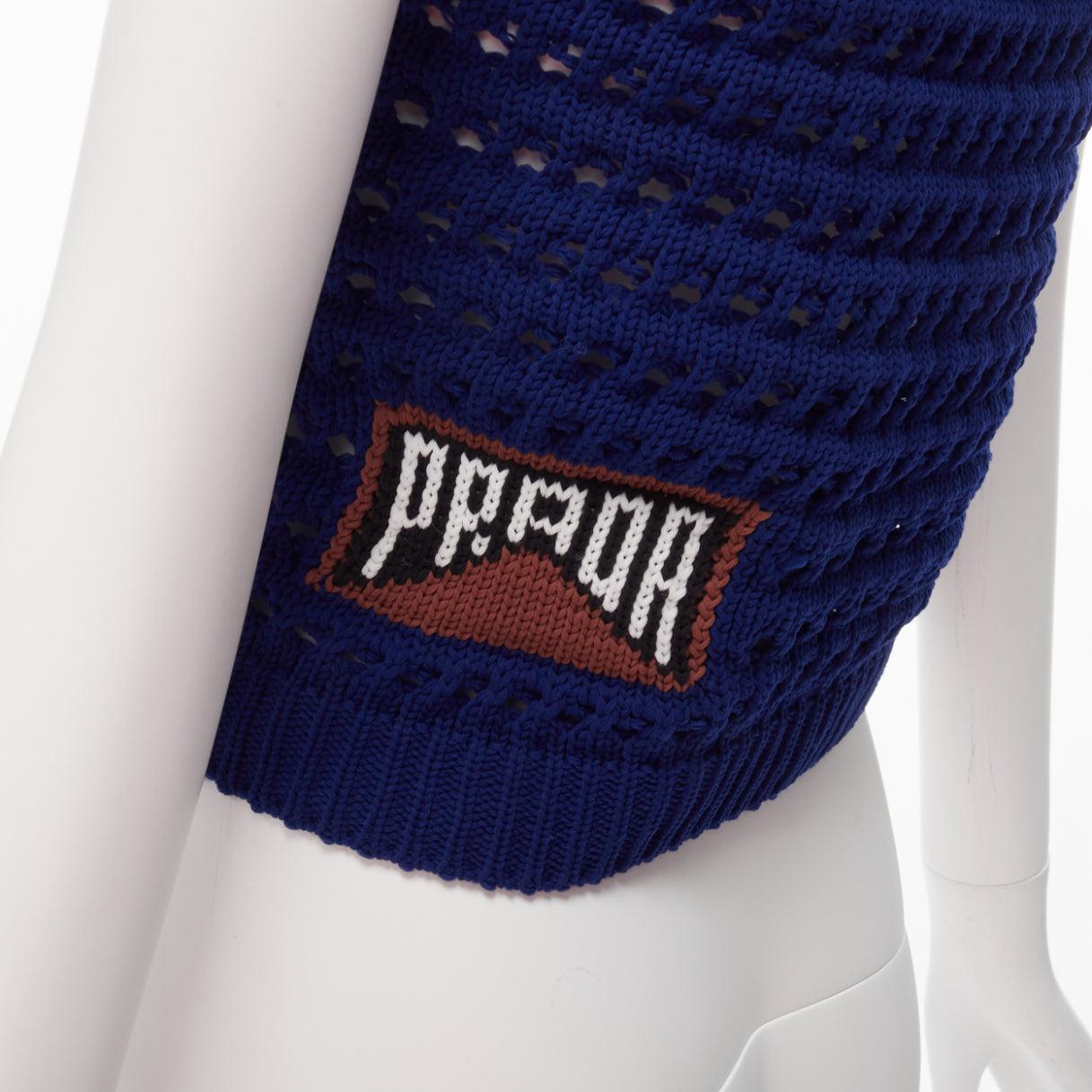 PRADA 2018 blue brown black logo crochet knit cropped tank top IT36 XXS
Reference: TGAS/D00565
Brand: Prada
Designer: Miuccia Prada
Collection: 2018
Material: Polyester
Color: Blue, Multicolour
Pattern: Solid
Closure: Pullover
Extra Details: PRADA
