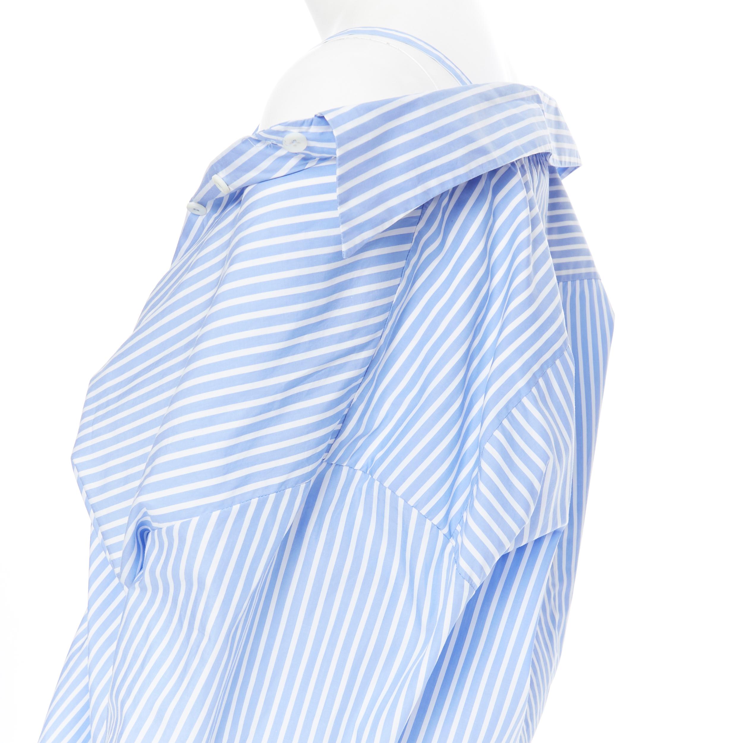 PRADA 2018 camicia oversize in cotone a righe bianche e blu IT38 XS
Riferimento: LNKO/A01285
Marchio: Prada
Stilista: Miuccia Prada
Collezione: 2019 
Materiale: Cotone
Colore: blu
Modello: A righe
Chiusura: bottone
Dettaglio extra: Il doppio
