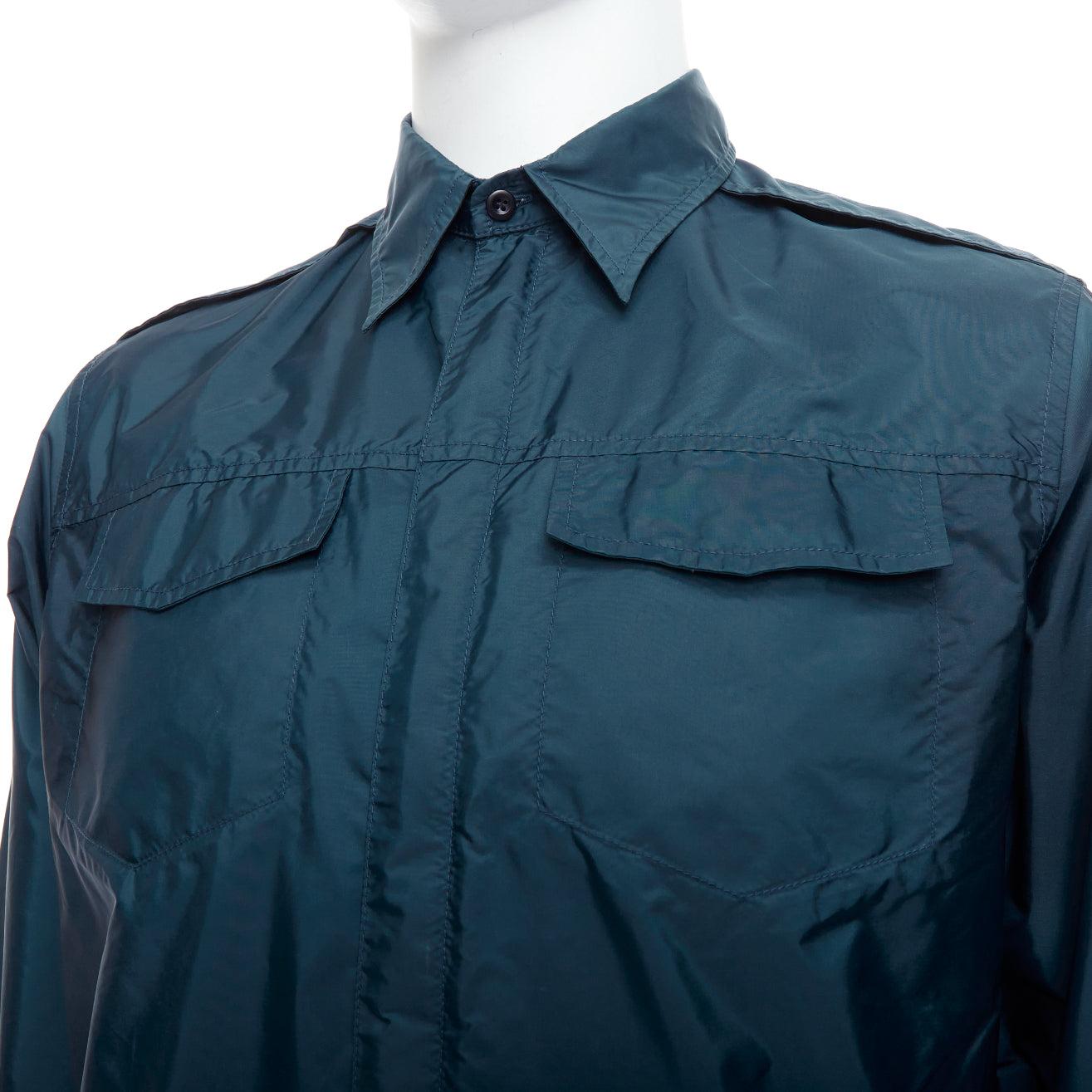 PRADA 2018 dark teal blue nylon concealed silver zip over shirt S
Reference: CNLE/A00338
Brand: Prada
Designer: Miuccia Prada
Collection: 2018
Material: Nylon
Color: Blue, Silver
Pattern: Solid
Closure: Zip
Extra Details: Conzealed silver zip.
Made