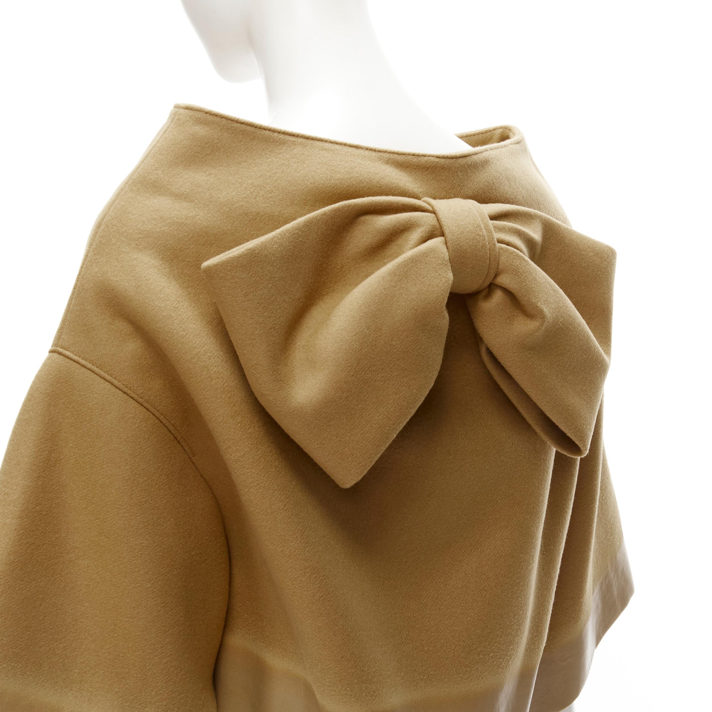 PRADA 2018 Runway beige Sports logo cocoon cape jacket S 
Reference: ANWU/A00464 
Brand: Prada 
Designer: Miuccia Prada 
Collection: Fall Winter 2018 
Material: Wool 
Color: Brown 
Pattern: Solid 
Closure: Zip 
Extra Detail: PRADA sports inspired