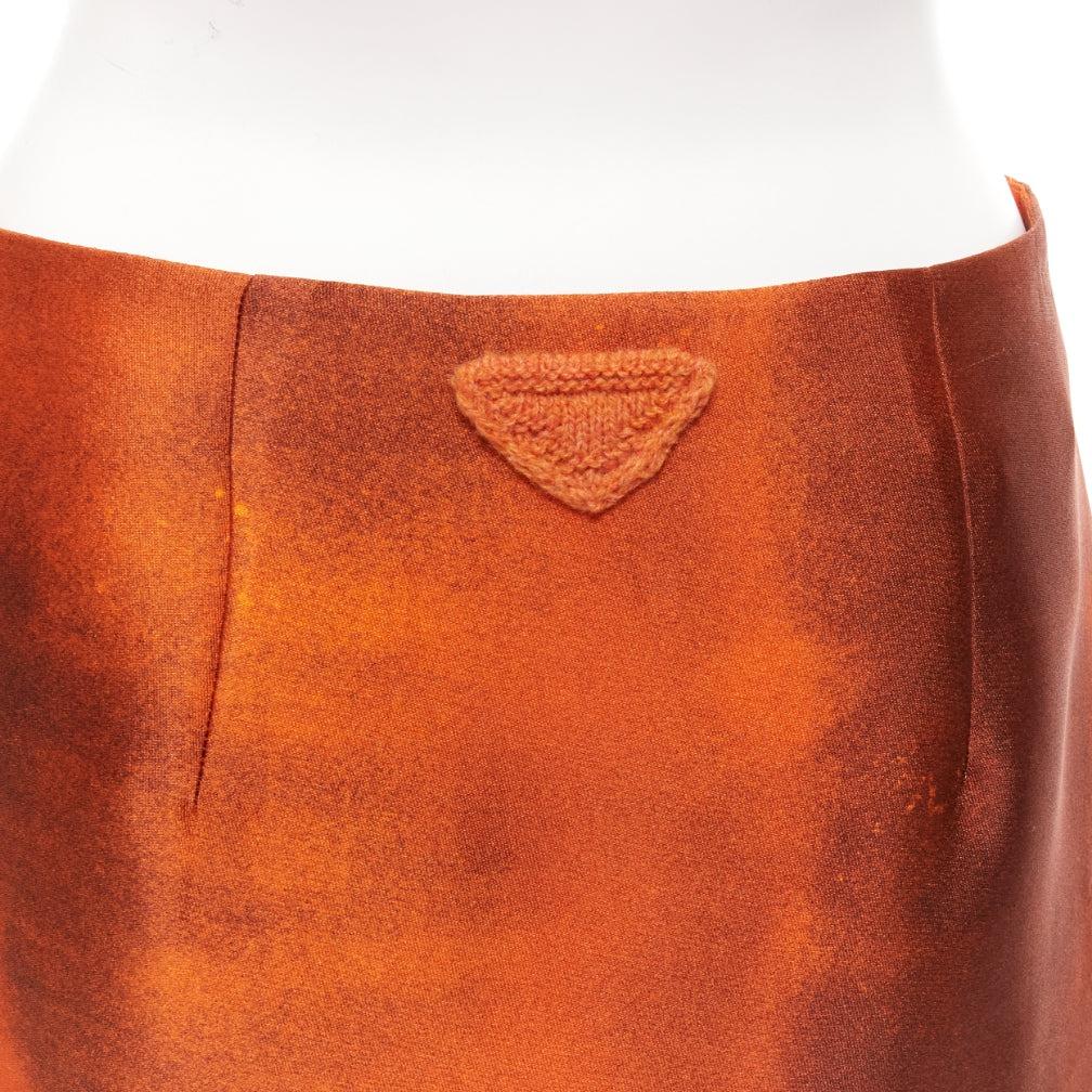 PRADA 2023 orange water dyed side slit crinkled silk blend skirt IT38 XS
Reference: NKLL/A00047
Brand: Prada
Designer: Miuccia Prada
Collection: 2023 - Runway
Material: Silk, Blend
Color: Orange, Cream
Pattern: Solid
Closure: Zip
Extra Details: This