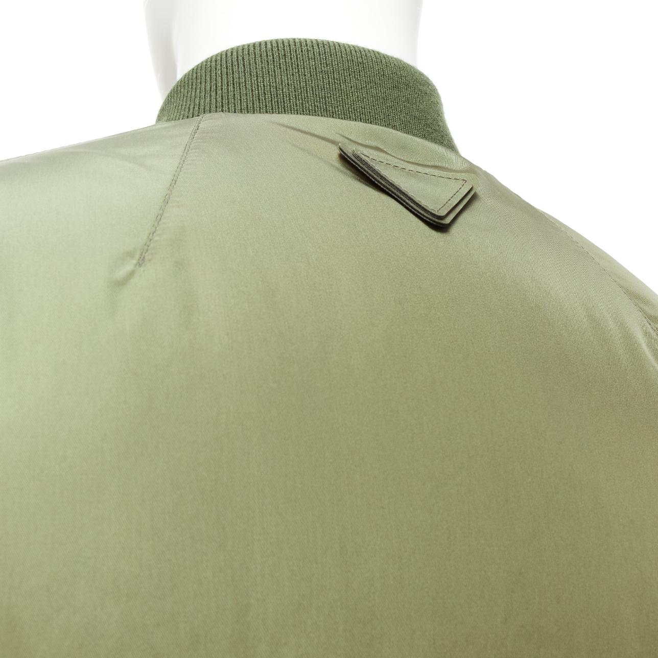 PRADA 2023 Runway green nylon cropped cocoon puffer bomber jacket M
Reference: TGAS/D01080
Brand: Prada
Designer: Miuccia Prada
Collection: Uomo 2023 Look 24 - Runway
Material: Nylon
Color: Khaki, Silver
Pattern: Solid
Closure: Zip
Lining: Orange