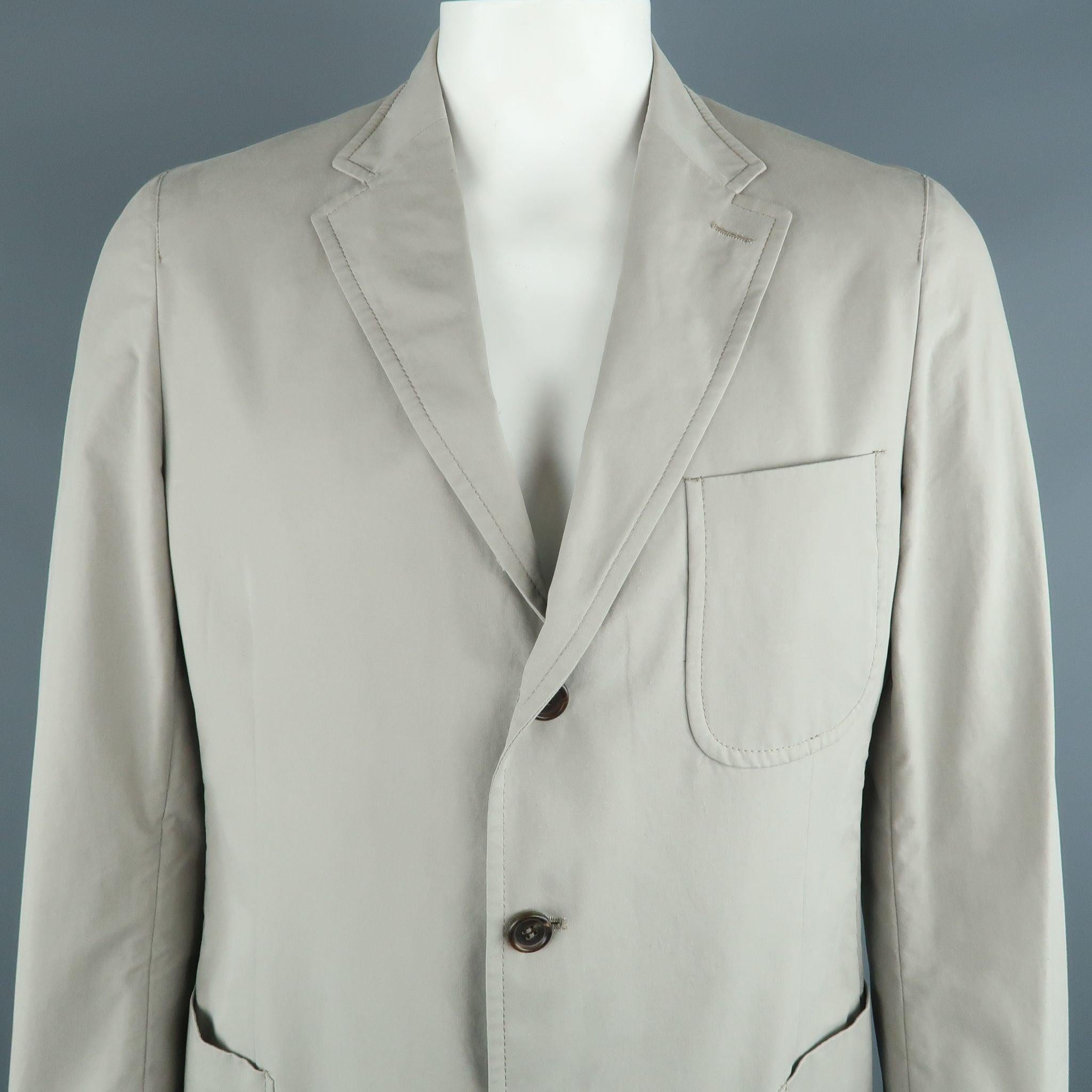 PRADA sport coat comes in light gray cotton featuring a notch lapel, three button closure, and patch pockets. Made in Italy.Excellent Pre-Owned Condition. 
 

 Marked:  54 R 
 

 Measurements: 
  
 Shoulder: 18.5 inches Chest: 40 inches Sleeve: 26.5