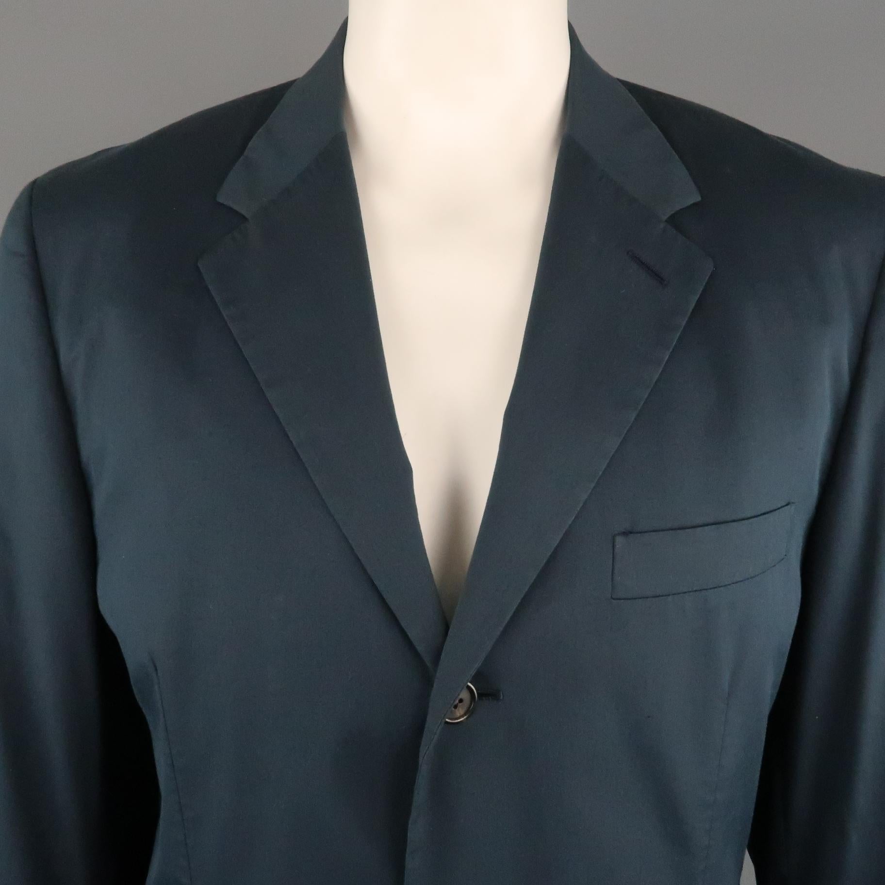 PRADA sport coat comes in a navy cotton blend featuring a notch lapel, flap pockets, and a two button closure. Made in Italy.
 
Very Good Pre-Owned Condition.
Marked: 54
 
Measurements:
 
Shoulder: 20 in.
Chest: 44 in.
Sleeve: 27 in.
Length: 27.5 in.