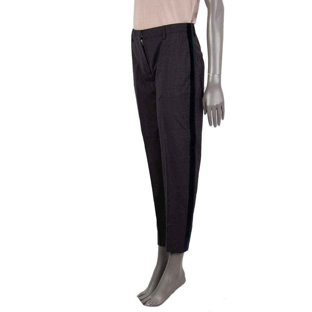 100% authentic Prada cropped pants in charcoal and midnight blue virgin wool (100%) with a velvet panelle on both sides, belt loops, slit-pockets in the frontand back. Unlined. Closes with a zipper, hoo and bar in the front. Has been worn and is in