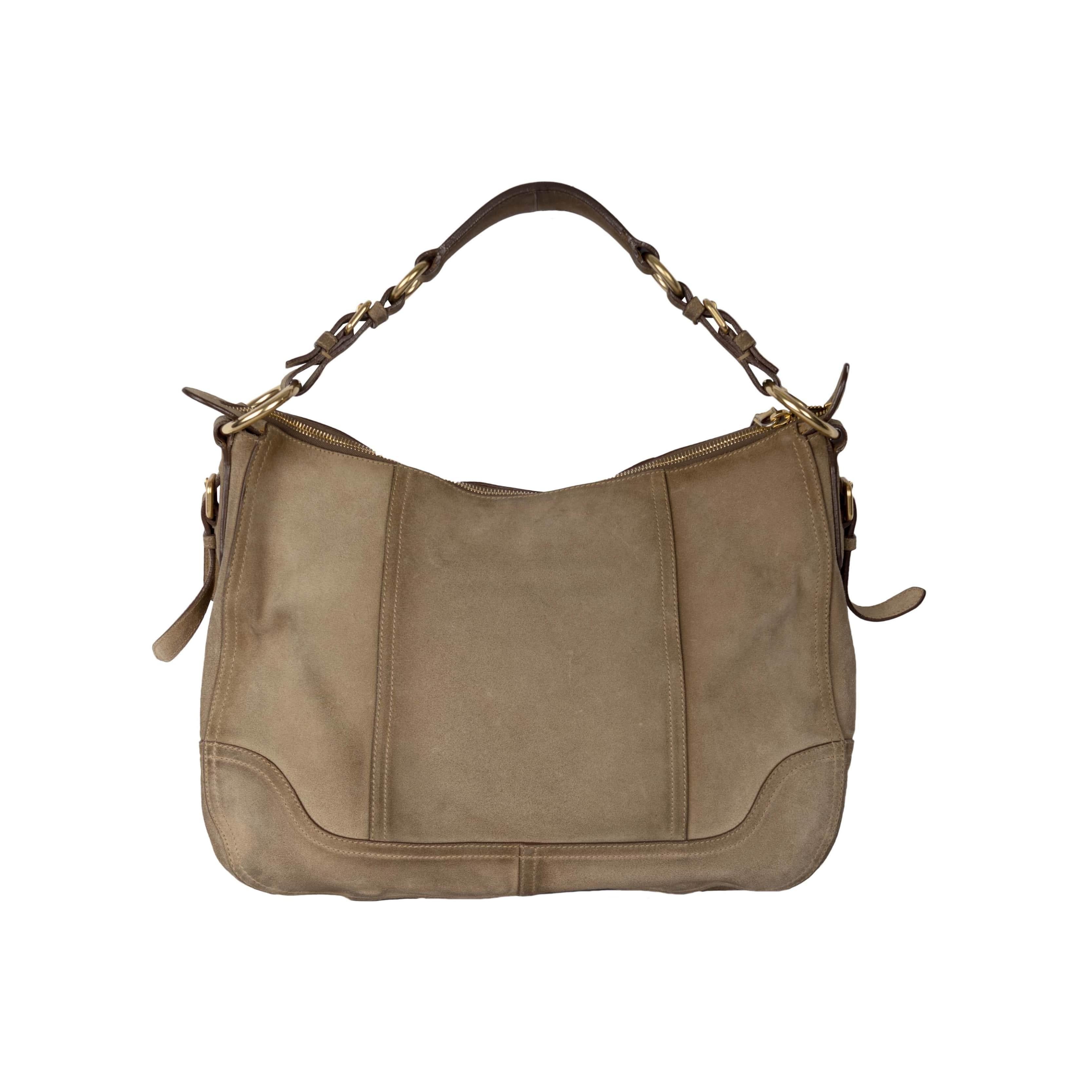 The Prada Antik Cervo Hobo Bag features golden hardware with differently shaped panels stitched together and the branded luggage tag hanging from the handle. The label is attached to the inside.
 
 Height:28;Width:36;Depth:12 Material: Suede