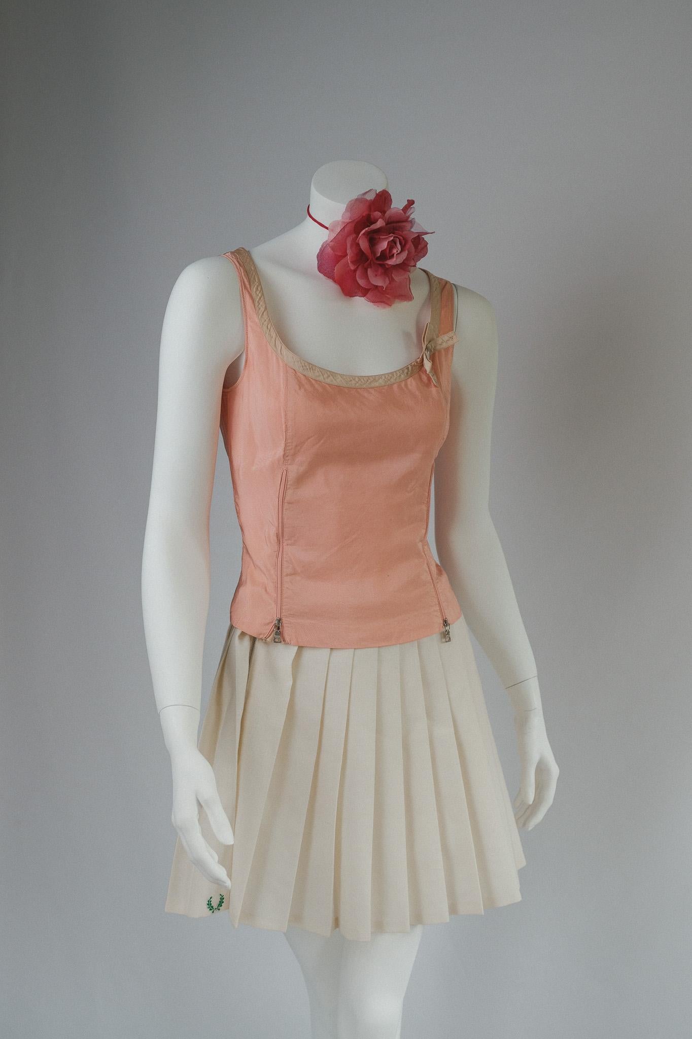 Prada Archival Baby Pink and Beige  Silk Corset Bustier Top w Zips Corset 
Pink silk with beige trim, beige lining. 

Tag size small 
good vintage condition,  wear to be expected of any secondhand or vintage item delicate silk item. 
Slight mark on