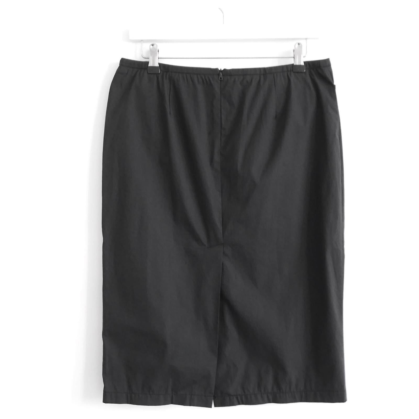 Super rare, new with tags archival Prada Linea Rossa (or Prada Sport) skirt from the 2000S. Made from crisp, vintage black cotton and nylon, it has a classic pencil cut with waist pockets and back slit. Has concealed back zipper with little Prada