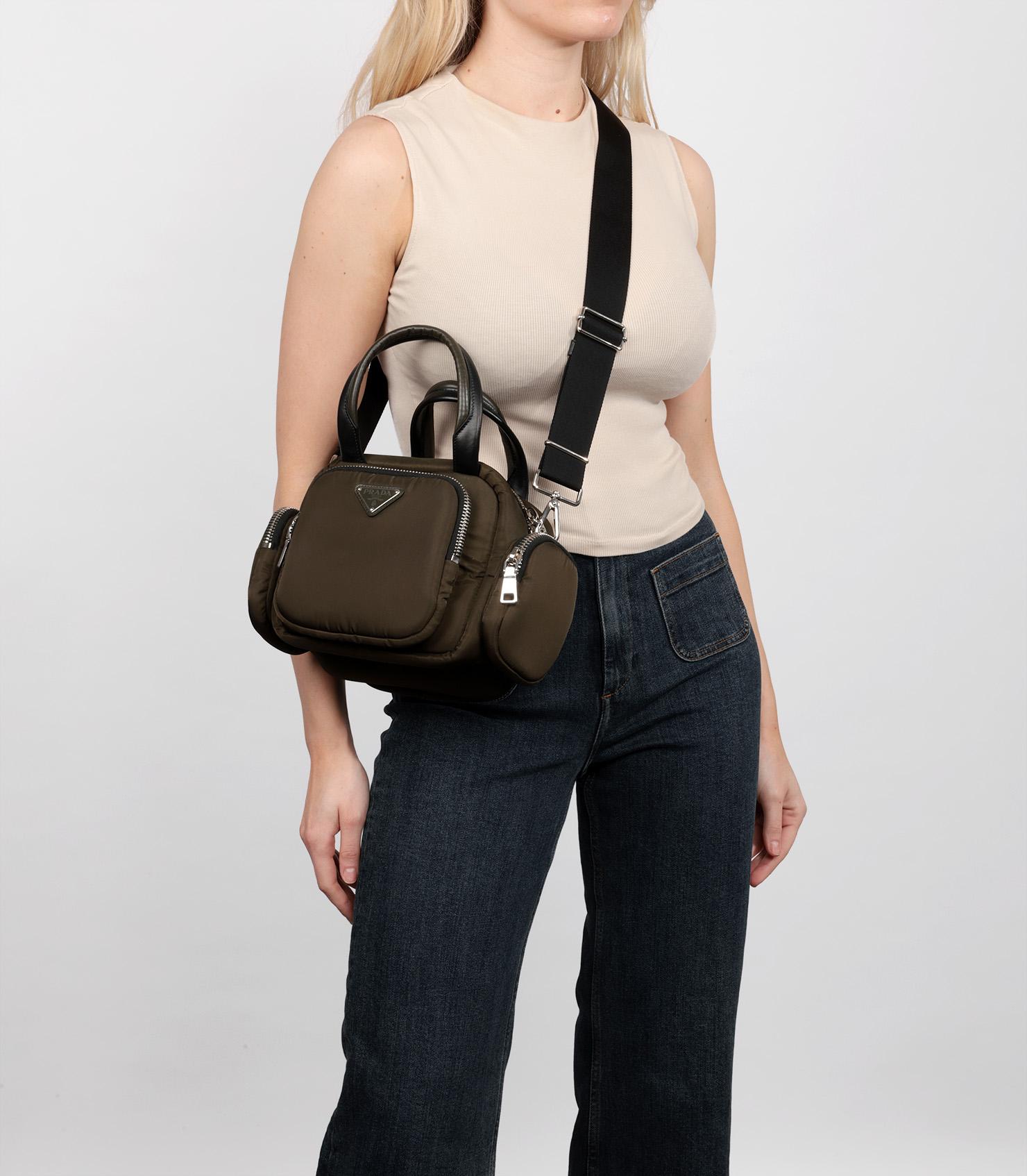 Prada Army Green Nylon & Black Lambskin Leather Cargo Bag

Brand- Prada
Model- Cargo Bag
Product Type- Crossbody, Tote
Serial Number- 25*
Age- Circa 2015
Accompanied By- Shoulder Strap
Colour- Army Green
Hardware- Silver
Material(s)- Nylon, Lambskin