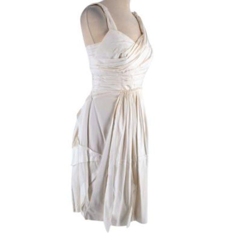 Prada asymmetric pleated cotton poplin dress

- Pleated and layering detailing throughout
- Zip fastening along back
- Shoulder straps
- Accentuated waist
- Asymmetric top
- Fully lined

Material
100% Cotton

Made in Italy

9.5/10 Excellent