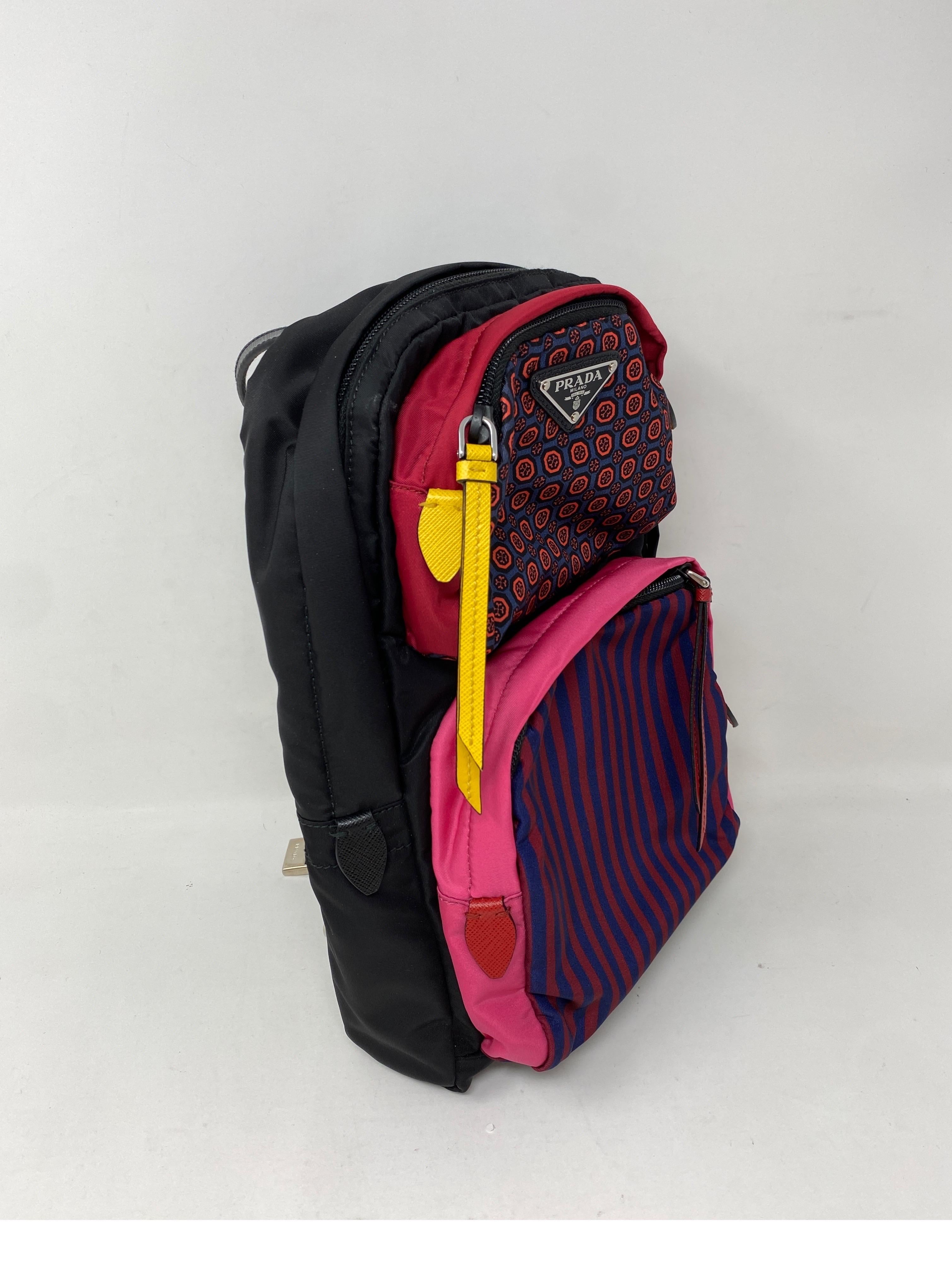 Prada Colorful Backpack. Multi color stripes detailed backpack. Black nylon back. One strap shoulder backpack. Mint like new condition. Comes with card and dust bag. Guaranteed authentic. 