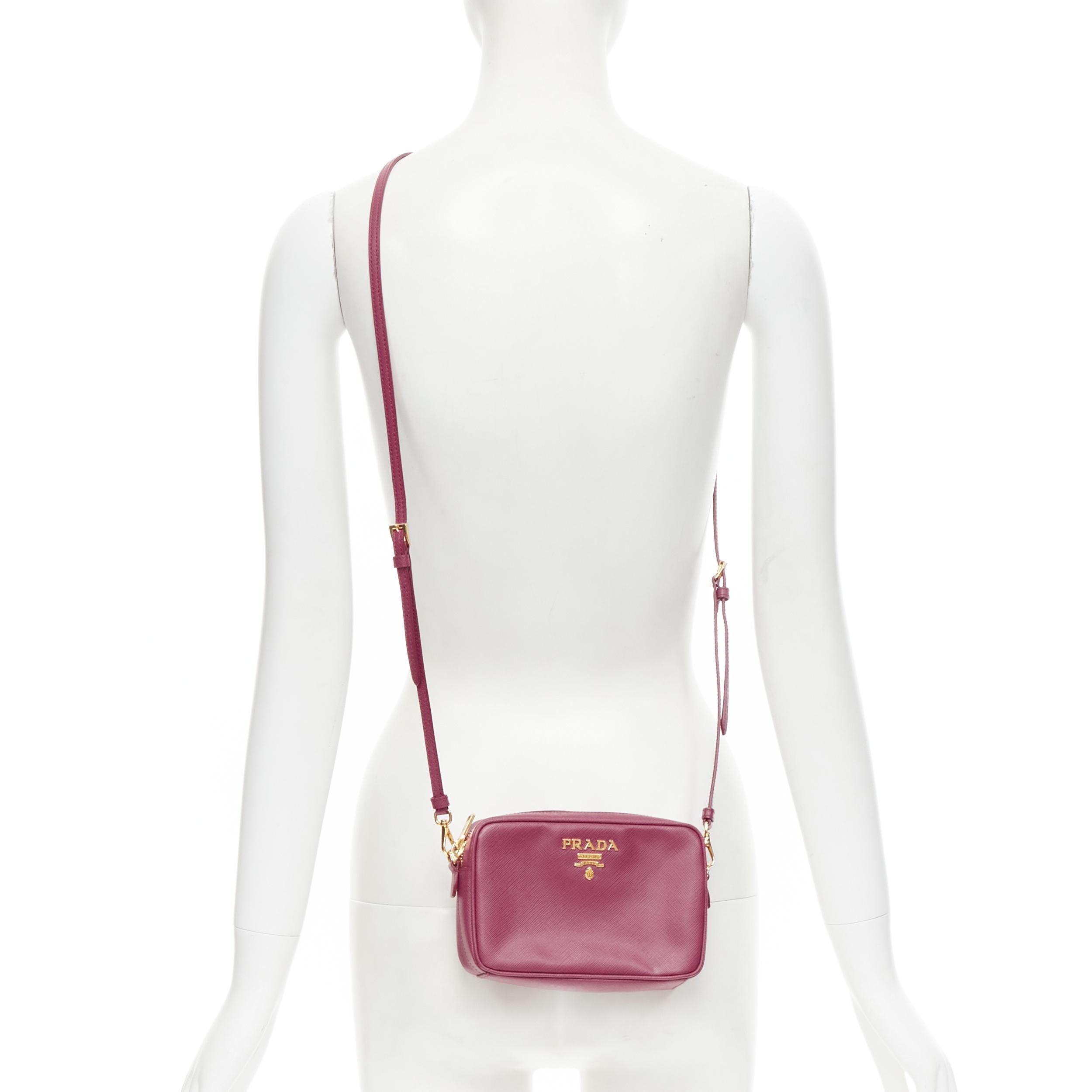 PRADA Bandoliera Bruyere pink saffiano leather gold logo crossbody camera bag 
Reference: TGAS/B01653 
Brand: Prada 
Designer: Miuccia Prada 
Model: Bandoliera Bruyere 
crossbody Material: Leather 
Color: Pink 
Pattern: Solid 
Closure: Zip 
Extra