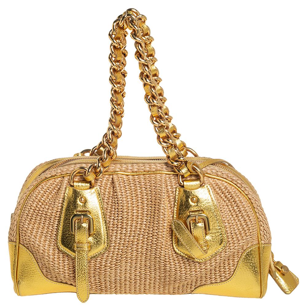 Add a touch of elegance to your look with this stylish satchel from Prada. Designed with woven straw and leather, this beige & gold bag will look lovely as ever, every time you carry it. The interior is well-lined and the two handles, as well as the