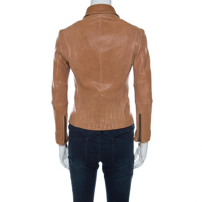 This fabulous biker jacket from Prada is chic, smart and very modern! The understated beige creation is made of 100% lamb leather and features smart collars, a front zip closure, zipped pockets placed stylishly on the front and long sleeves. It is