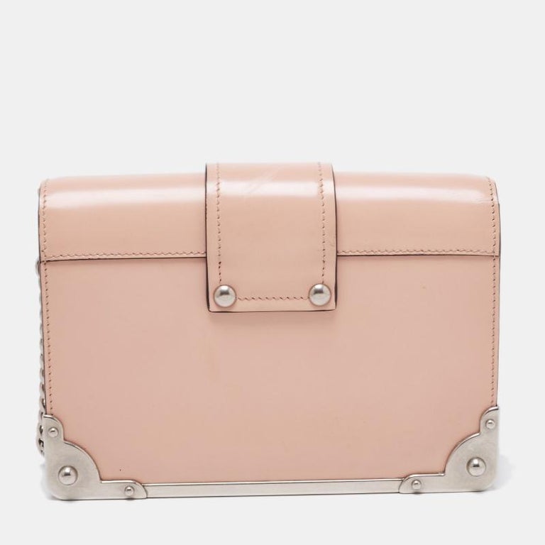 Make this uniquely designed Prada shoulder bag your own right away! It is a highly structured piece complete with silver-tone details, a leather exterior, and a luxurious well-sized interior. Style with a maxi dress for that added touch of