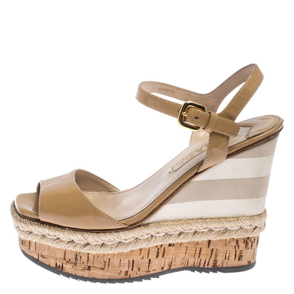 These Prada wedge sandals will bring you the perfect amount of style and comfort. They feature patent leather straps, buckle closure around the ankles and are set on wedge heels. They are lovely and easy to flaunt.

Includes: The Luxury Closet