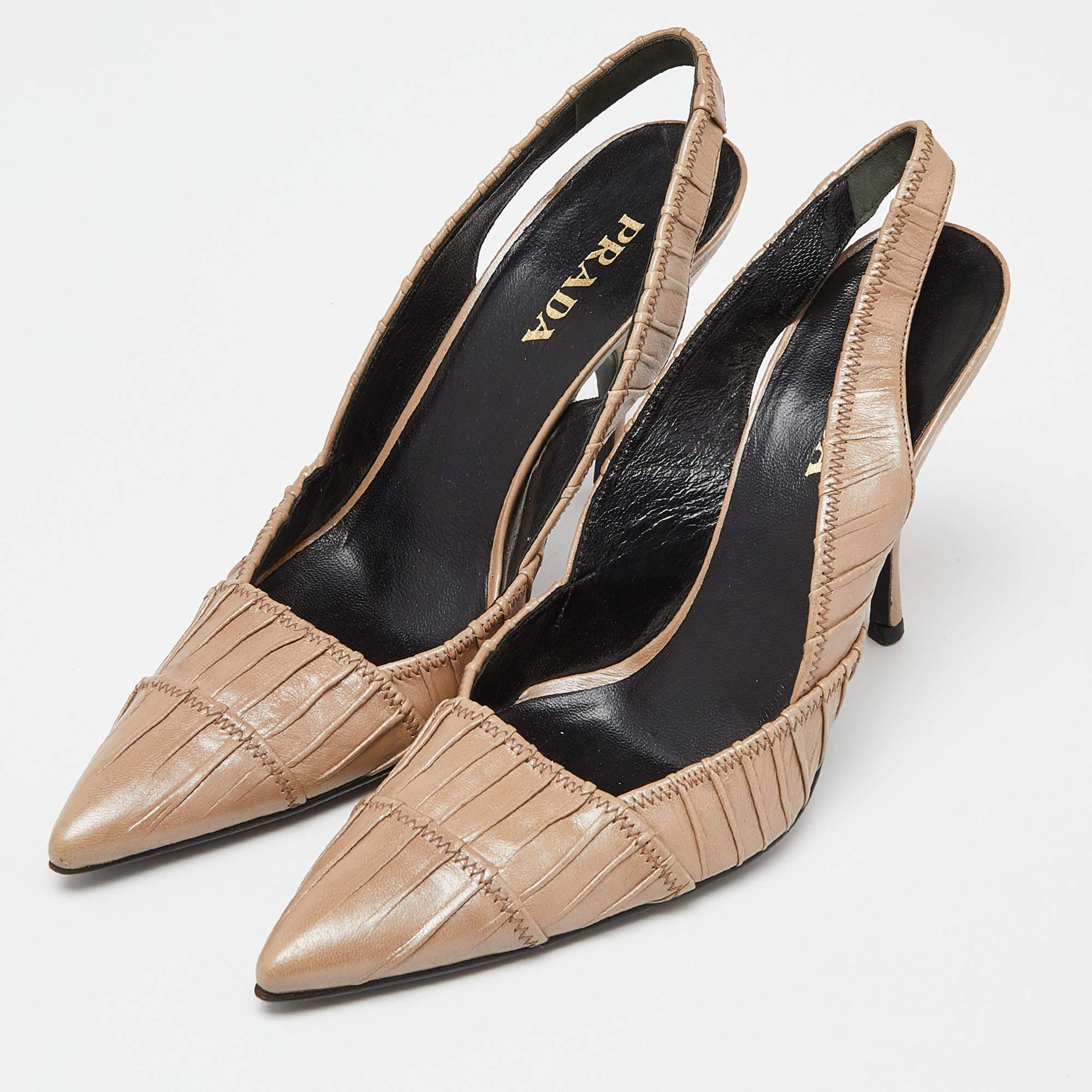 A feminine flair and a sophisticated appeal characterize these stunning Prada slingback sandals. Crafted using pleated leather in a beige shade they will add an opulent charm to your look and complement many looks that you would want to create.