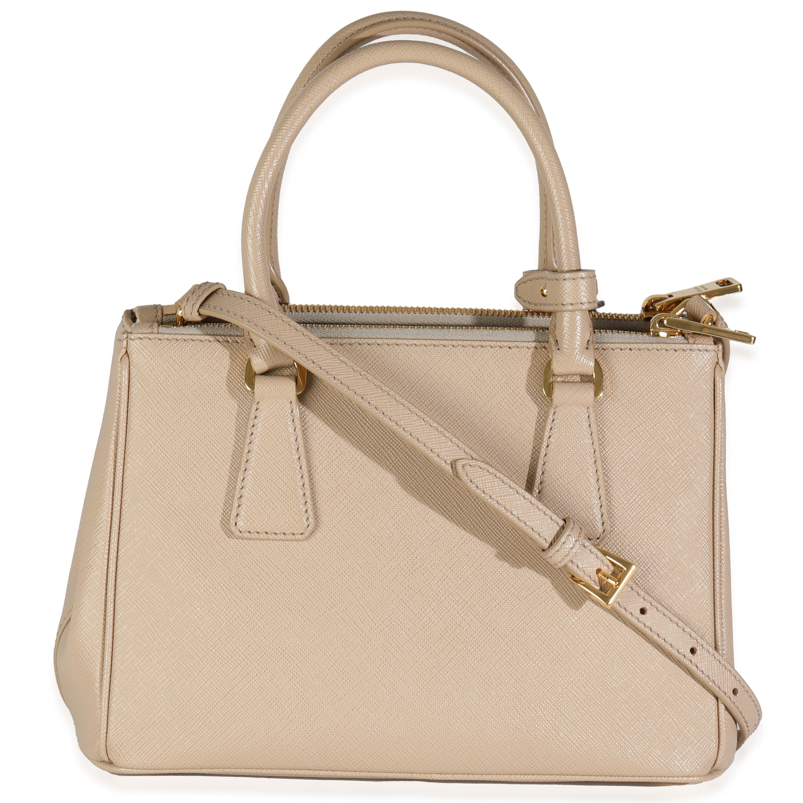 Listing Title: Prada Beige Saffiano Mini Galleria Double Zip Tote
SKU: 145003
Condition: Pre-owned 
Handbag Condition: Pristine
Condition Comments: Item has no indication of wear.  Final sale.
Brand: Prada
Model: Mini Galleria Double Zip Tote
Origin