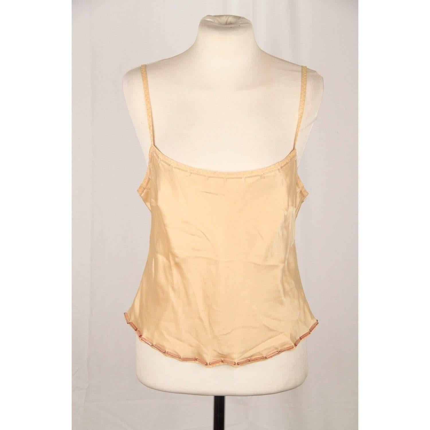 MATERIAL: Silk COLOR: Beige MODEL: CamiTop GENDER: Women SIZE: Small CONDITION RATING: A :EXCELLENT CONDITION - Used once or twice. Looks mint. Imperceptible signs of wear CONDITION DETAILS: Gently used! MEASUREMENTS: SHOULDER TO SHOULDER: - BUST: