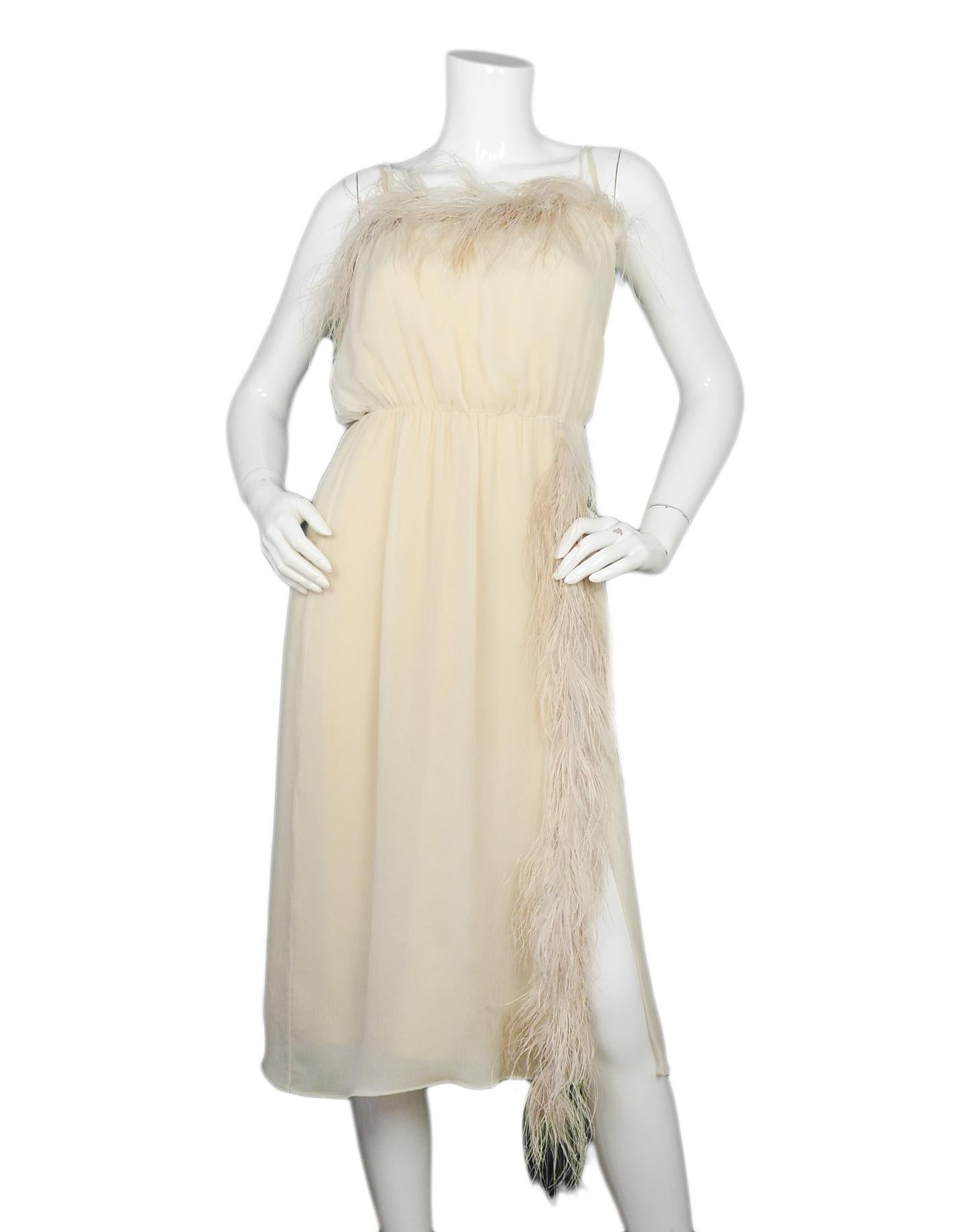 Prada Beige Silk Dress W/ Feather Trim IT38/US2

Made In: Italy
Color: Beige
Materials: 100% silk, feathers 
Lining: Attached silk slip
Opening/Closure: Pull over
Overall Condition: Excellent pre-owned condition 

Tag Size: IT38/US2
Shoulder To