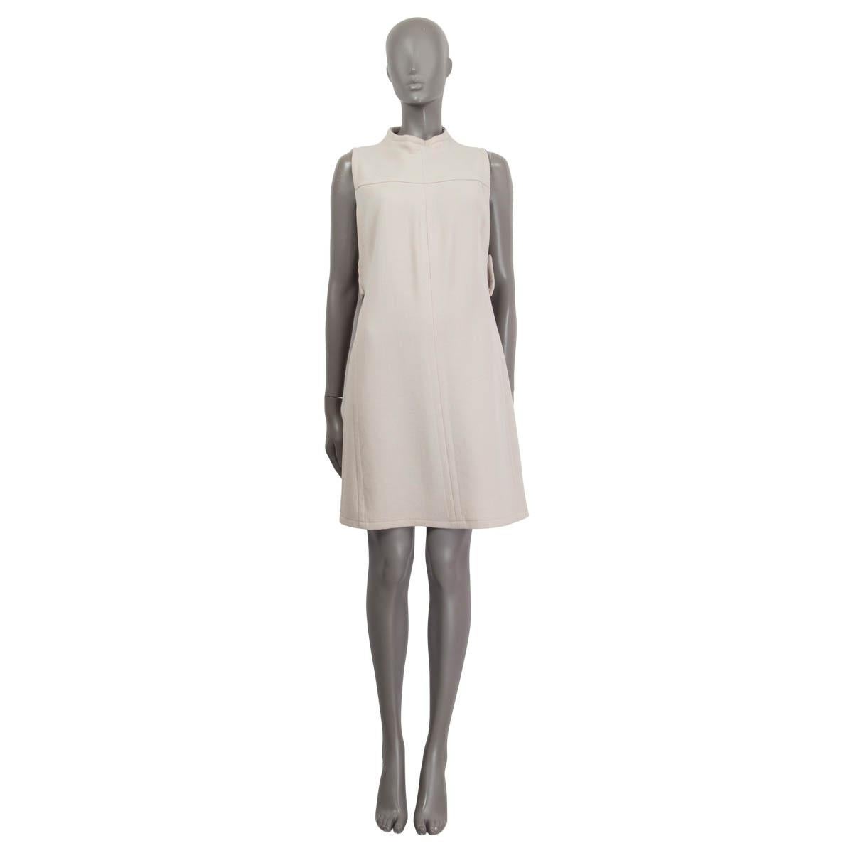 100% authentic Prada sleeveless dress in beige virgin wool (100%). Features a belt on the back and opens with a concealed zipper and a hook on the back. Unlined. Has been worn and is in excellent condition.

Measurements
Tag Size	46
Size	XL
Shoulder