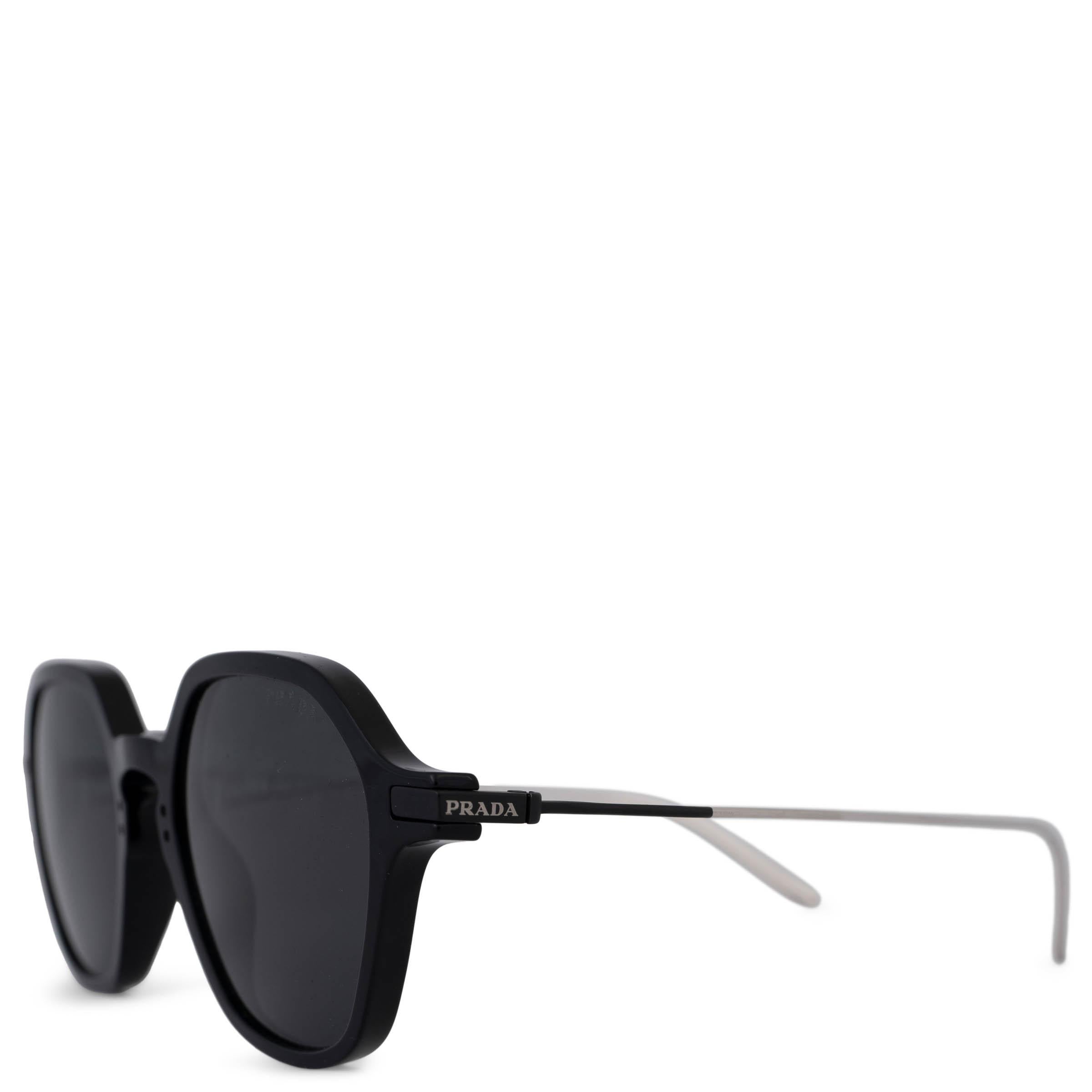 These 100% authentic Prada geometric sunglasses are crafted from black acetate and feature dark grey lenses for a bold, modern look. The design is complemented by thin metal temples with the Prada logo print, adding a sleek and sophisticated touch.