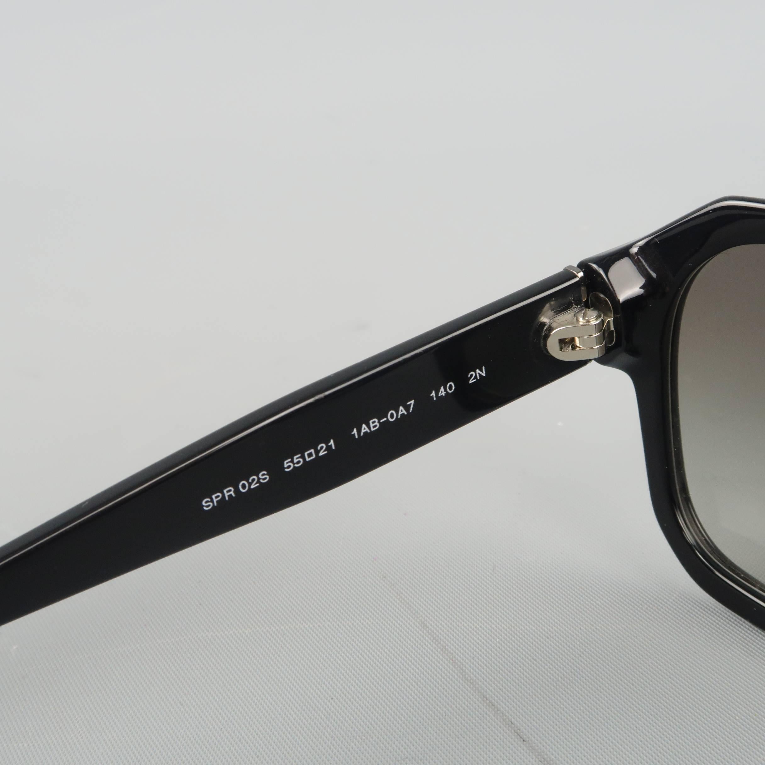 PRADA flat top sunglasses come in glossy black acetate with angular shape, taupe gradient lenses and silver tone logo arms. Minor wear. As-is. Made in Italy.
 
Fair Pre-Owned Condition.
Marked: SPR 02S 55 21 1AB-0A7 140 2N
 
Measurements:
 
Length:
