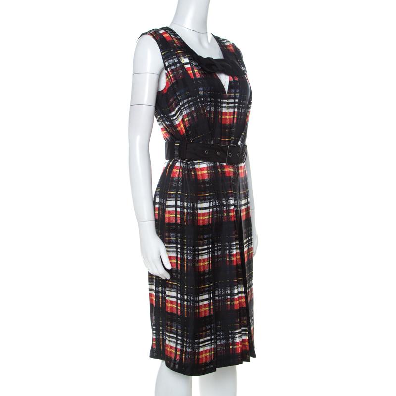 Look your best everywhere you go in this sleeveless dress from the house of Prada. Made from silk, it has prints of plaid all over and a belt detail that gives it shape. Make sure to style the dress with minimal accessories.


