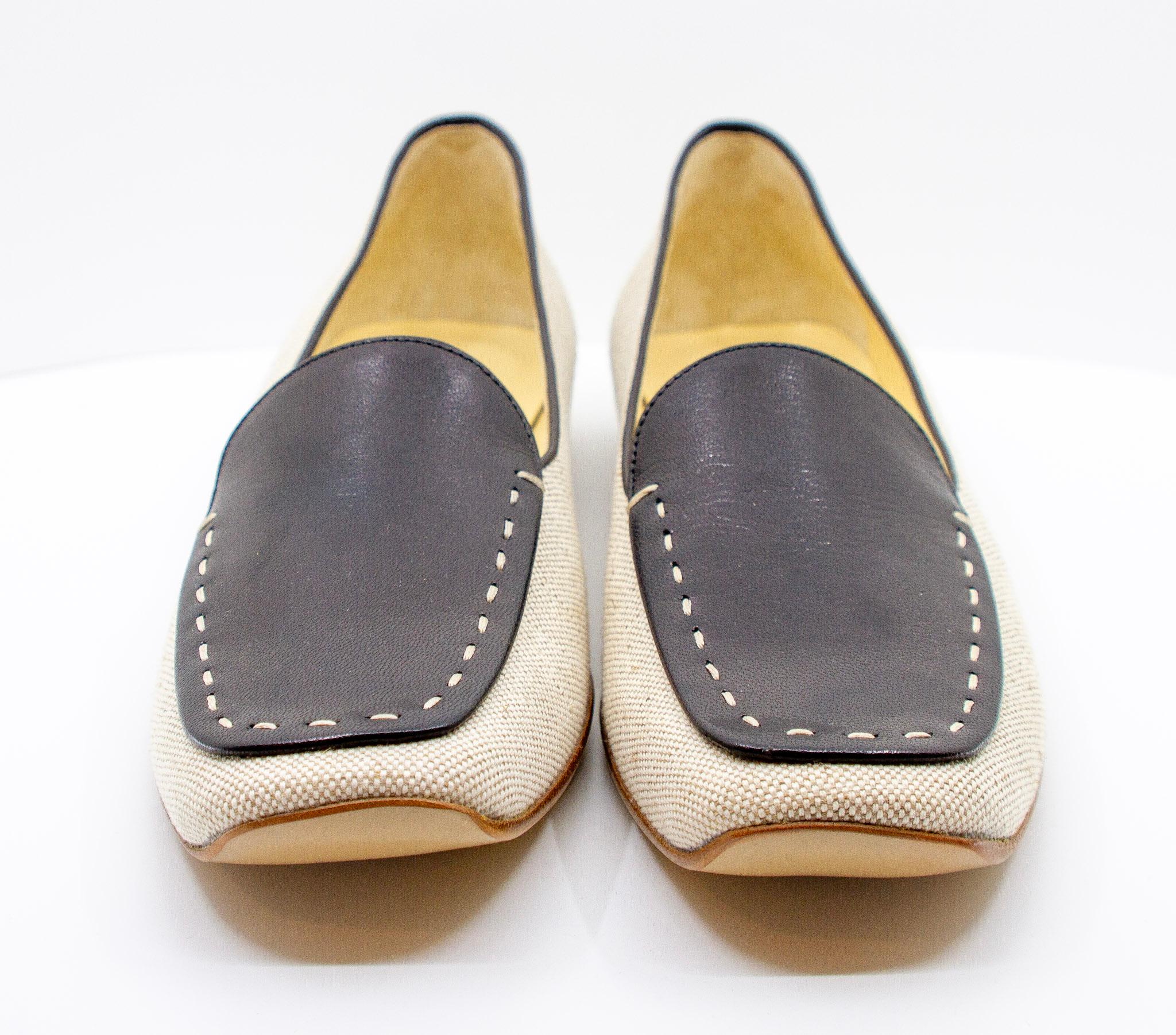 Prada black and white loafer style flats 

Size 40IT, 41FR, 10US