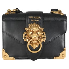 Borsa a tracolla Prada Antic Soft Saffiano Testa di leone nera Cahier