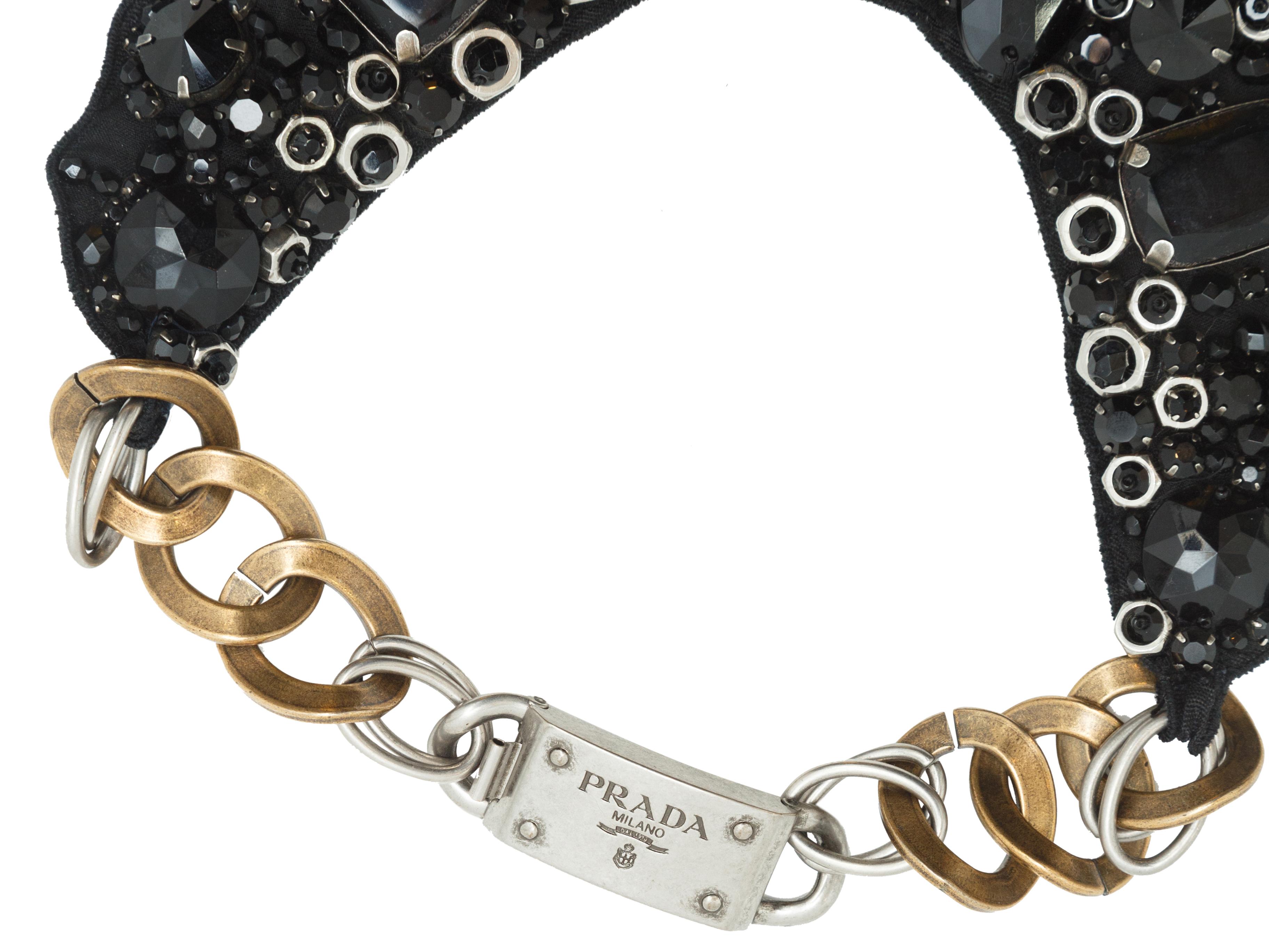 Product details:  Black beaded bib necklace by Prada.  Chunky chain with logo buckle.  Goldtone and silvertone hardware.  18.5