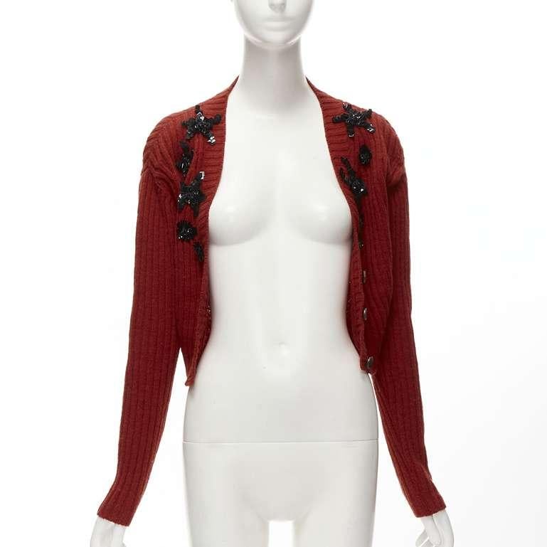 PRADA black beaded floral applique red wool cropped cardigan IT44 L
Reference: TGAS/C01622
Brand: Prada
Designer: Miuccia Prada
Material: 100% Wool
Color: Red, Black
Pattern: Solid
Closure: Button
Made in: Italy

CONDITION:
Condition: Good, this