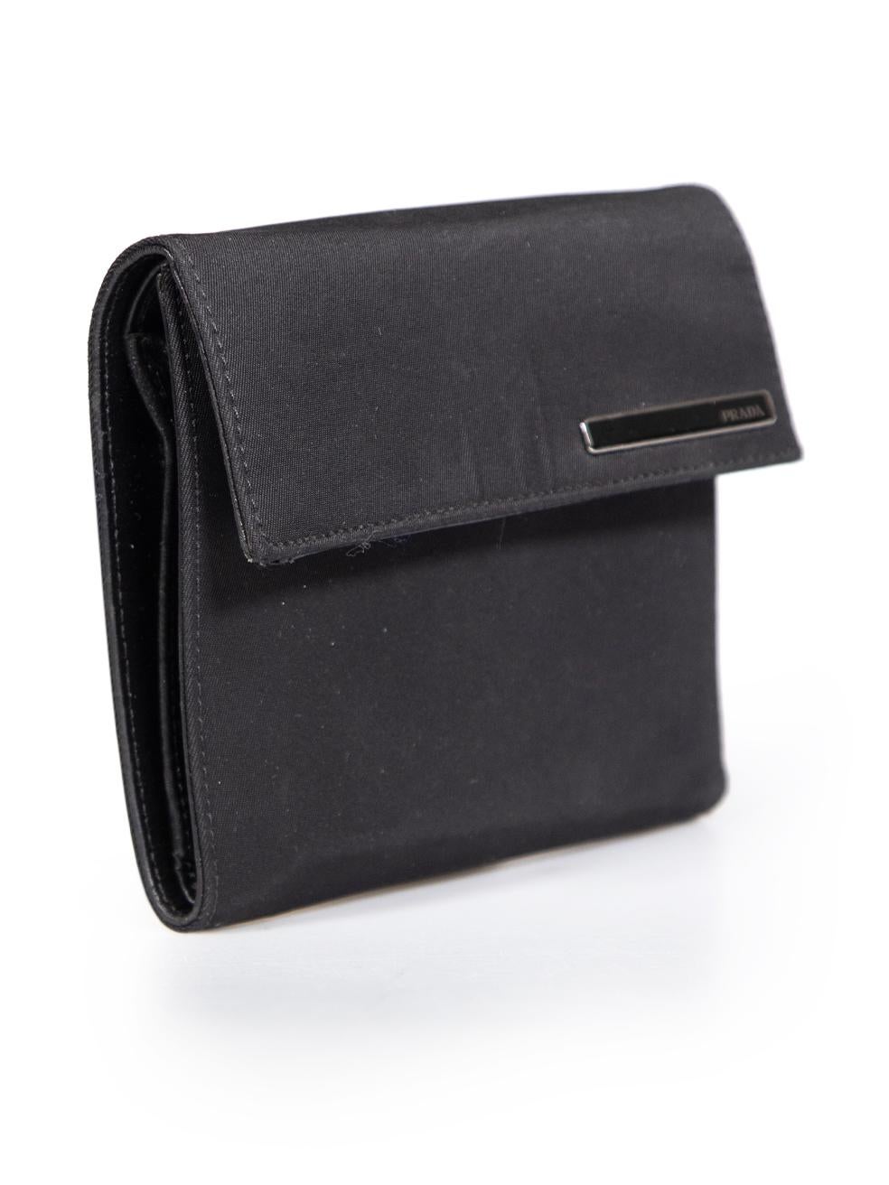 CONDITION is Very good. Minimal wear to the wallet is evident, there are scratches on the logo hardware on the front. There is minor creasing to the leather on the inside corners and a light abrasion on the middle compartment pocket of this used
