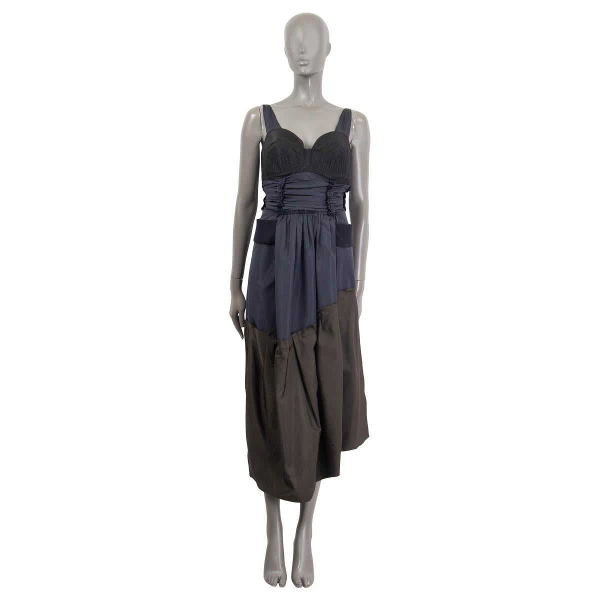 100% authentic Prada gathered bustier dress in khaki green, navy blue and black silk (56%) and  polyester (44%). Embellished with embroidery on the breast. Comes with belt in navy blue virgin wool (100%). Opens with a concealed zipper and a hook on