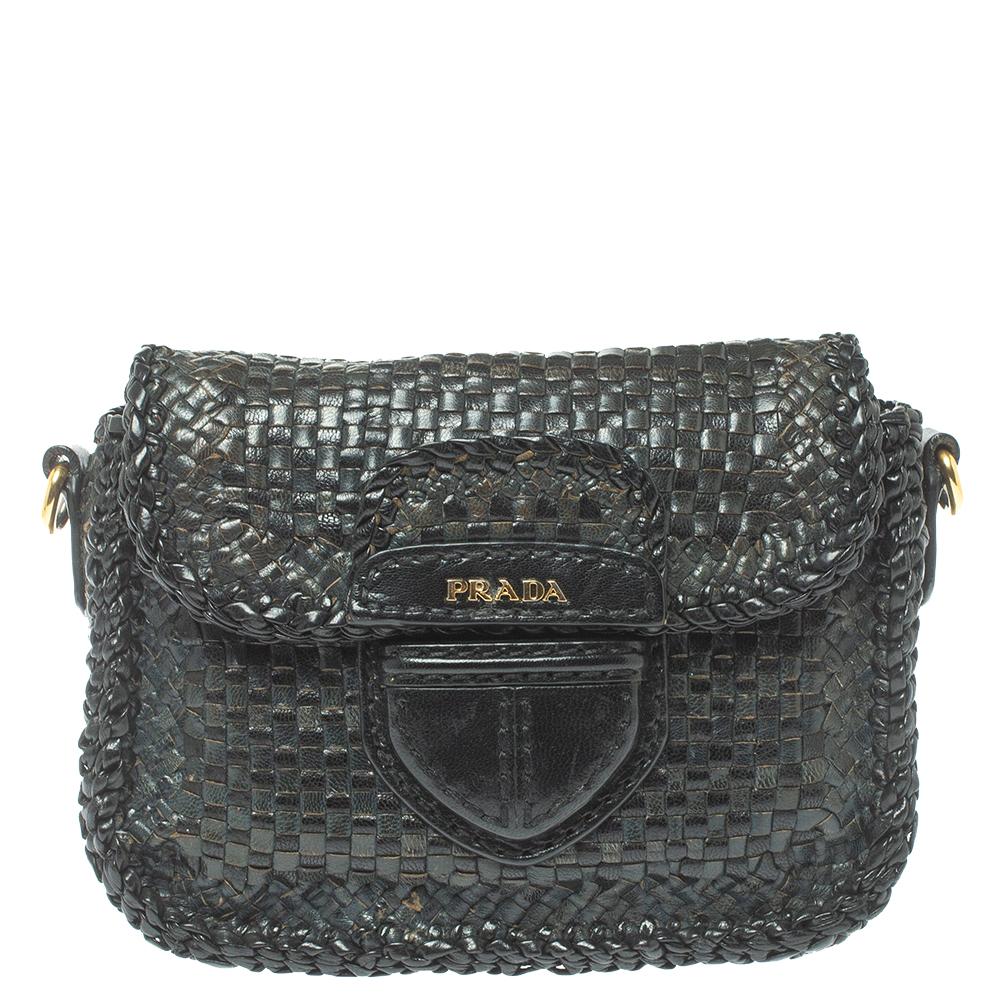 A flawless creation by Prada, this Madras bag is a must-have. Part of the collections bearing the 