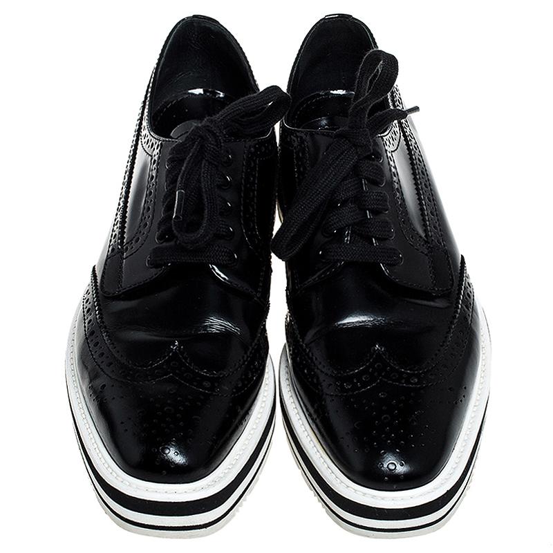 How can one not be in awe by just looking at this luxe pair from Prada! The leather Derby sneakers are well-crafted and they are beautified with lace-ups and wingtip detailing. Comfortable insoles and chunky platforms complete this must-have pair!